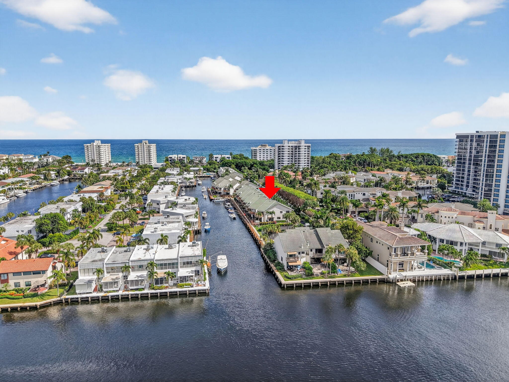 Waterfront Townhome with Stunning Intracoastal Views, Dedicated Boat Dock & Deeded Beach Access. Experience the best of coastal living nestled within a Gated, resort-style community with convenient access to the best of both Downtown Boca Raton & Delray Beach. Located just 2 units off intracoastal, this updated home features 2 large waterfront decks, 3 beds, 2 1/2 baths, & garage with additional community parking. The primary suite boasts vaulted ceilings, private deck, luxurious bathroom & large walk-in closet. NEW ROOF installed in 2024. The 3rd bedroom, currently used as a home office with elegant French doors, can easily be converted back into a full bedroom with a closet. The 2nd bedroom is generously sized with a king bed. Fireplace is decorative and non-functional. Community includes a gated entry, deeded beach access, resort style pool, fitness center, newly renovated clubhouse & direct access to scenic walks along Ocean Drive. Don't let this opportunity pass you by!