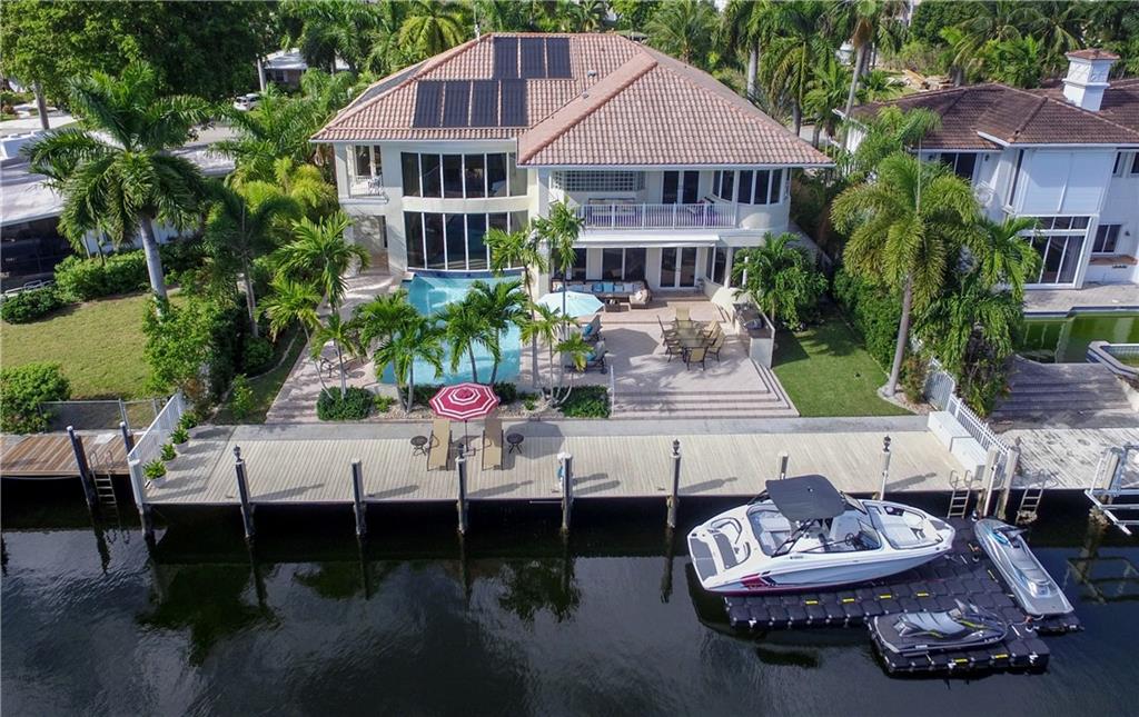 Beautiful custom waterfront residence offered furnished and turn key.  2 Story 3 car property, 85" canal frontage, ocean access with no fixed bridges. 6 Bedrooms plus den  features dramatic living room with view of infinity pool, fireplace, and wet bar.  Chef's kitchen opens to expansive family room, separate formal dining room and butler's pantry.  1 bedroom on first level, library, luxurious Main Suite with private balcony upstairs, separate his/her closets, exercise room, bedrooms split 3 ways for privacy, separate guest suite with sitting room and balcony. Beautiful custom residence offered furnished and turn key.  6 Bedrooms plus den features dramatic living room with view of infinity pool, fireplace, and wet bar.  Chef's kitchen opens to expansive family room, separate formal dining room and butler's pantry.  1 bedroom on first level, library, luxurious Main Suite with private balcony upstairs, separate his/her closets, exercise room, bedrooms split 3 ways for privacy, separate guest suite with sitting room and balcony.