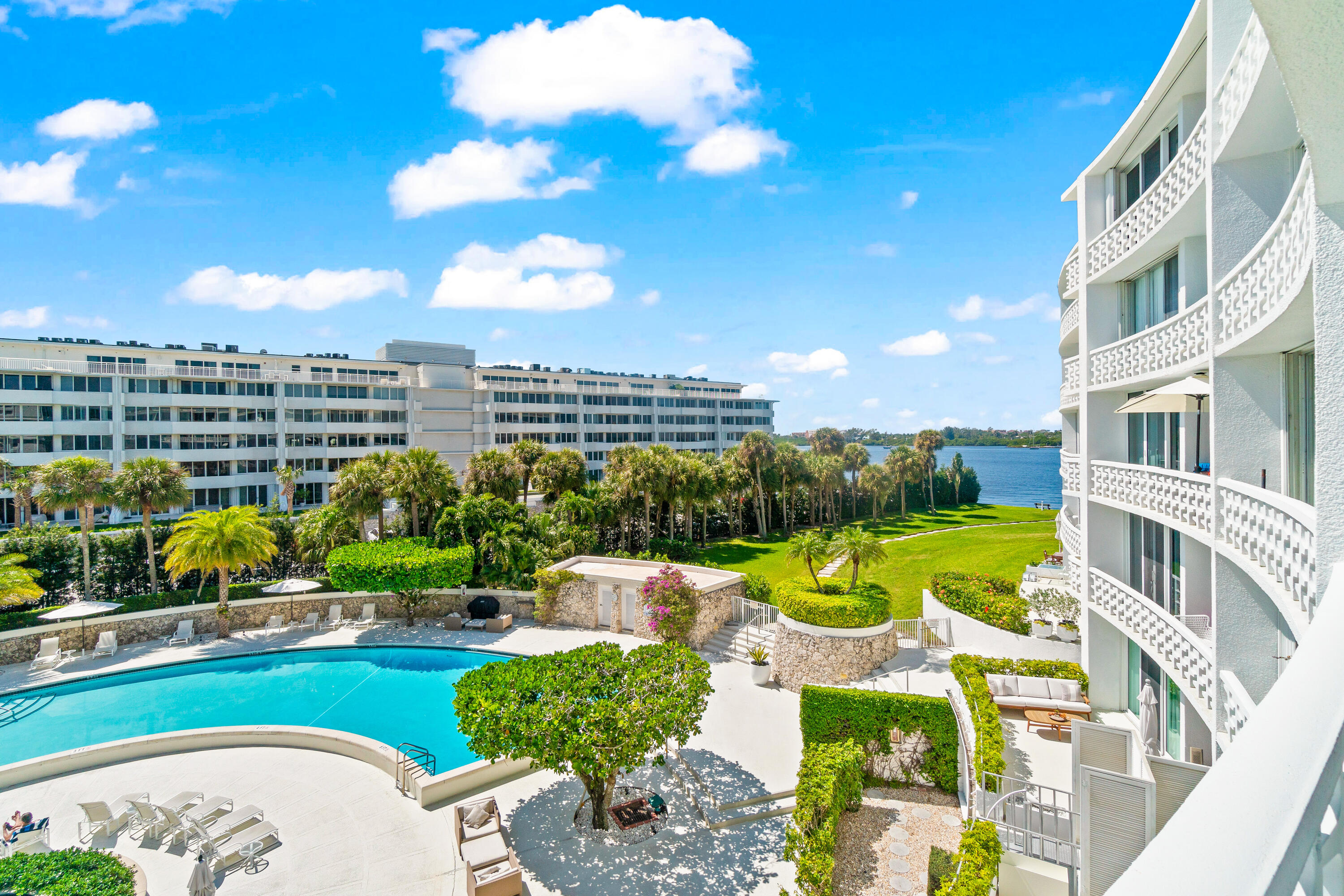 This sun-filled tastefully renovated apartment features large white tile floors, a stylish kitchen, and a modern bath in elegant neutral tones. Hurricane-rated sliders from every room open to a spacious terrace, perfect for relaxing and watching boats glide by. The Regency offers top-tier amenities, including a resort-style pool, fitness center,  sauna, extra storage, a community room, and a deeded beach path near the Four Seasons. With a doorperson, full-time manager, and on-site maintenance, enjoy effortless living. Just minutes from golf, tennis, fine dining, luxury shopping, and Worth Avenue.