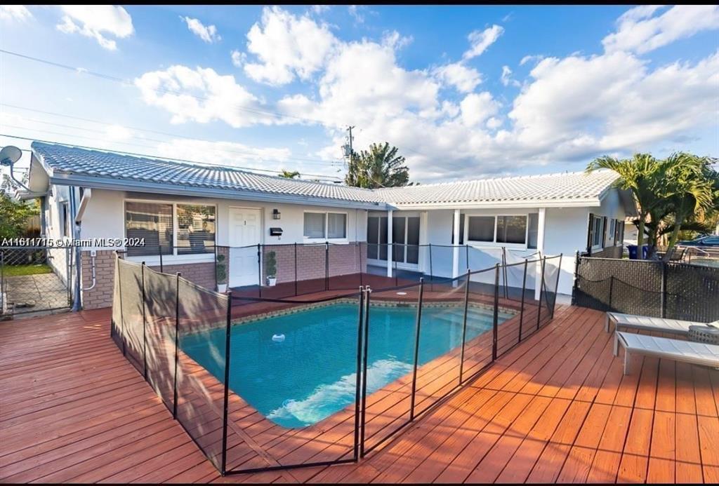 SHORT TERM IN THE BEAUTIFUL GARDENS ISLES NEIGHBORHOOD OF POMPANO BEACH. UNIT 1 HAS:2 BEDROOMS, 2 BATHS, METICULOUSLY FURNISHED, NEW/UPDATED KITCHEN WITH STAINLESS STEEL APPLIANCES, DINNING ROOM, LARGE LAUNDRY ROOM WITH WASHER/DRYER,  THE POOL FEATURES WOODEN DECK, A CONVENIENT TESLA CHARGER AND A PRIVATE FENCED BACKYARD. RARE TERRAZZO FLOORING THROUGHOUT THE UNIT, NEWER AC'S. SEPARATE ELECTRIC METERS, NEAR RESTAURANTS, PLAYGROUND/PARK, HIGHWAY 95, WITHIN 3 MILES TO THE BEACH, HOUSES OF WORSHIP AND MUCH MORE.