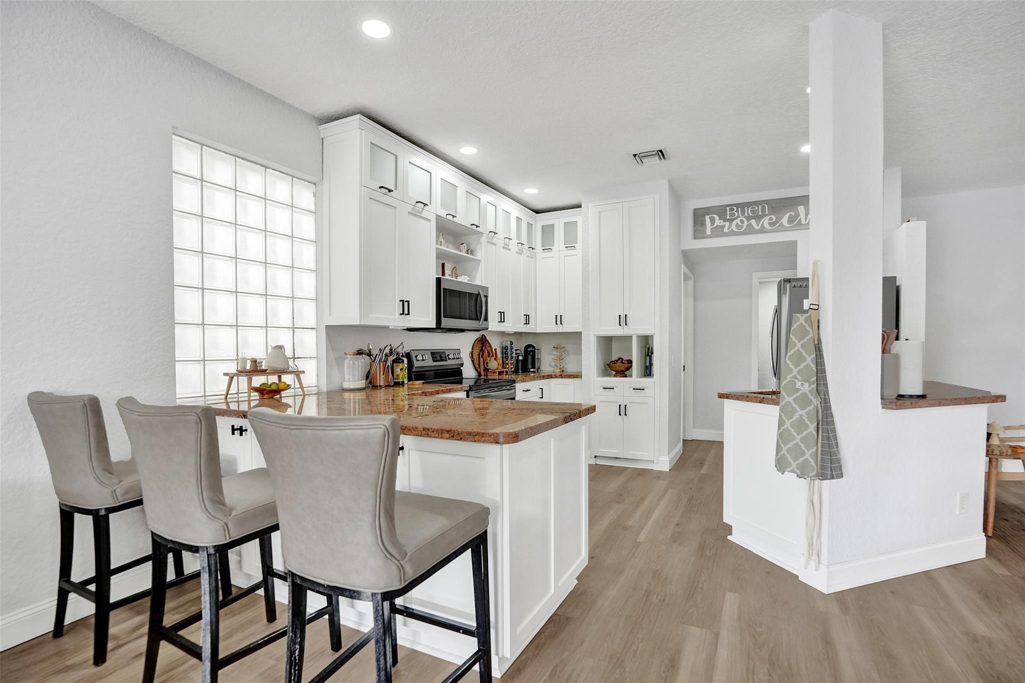 This beautifully updated 4BR/2.5BA waterfront home offers serene water views from a large private patio & backyard., an open layout with upgraded kitchen and baths. All windows & doors are hurricane protected with panels & accordion shutters throughout. The spacious primary suite includes two walk in closets, soaking tub, shower, and double sinks. Triple split bedrooms provide added privacy. Solar power keeps utility costs low and offers reliable backup. Low HOA covers lawn care, sprinklers, and community pool. Minutes from Coral Springs Mall, Sawgrass Expressway, and the Turnpike.