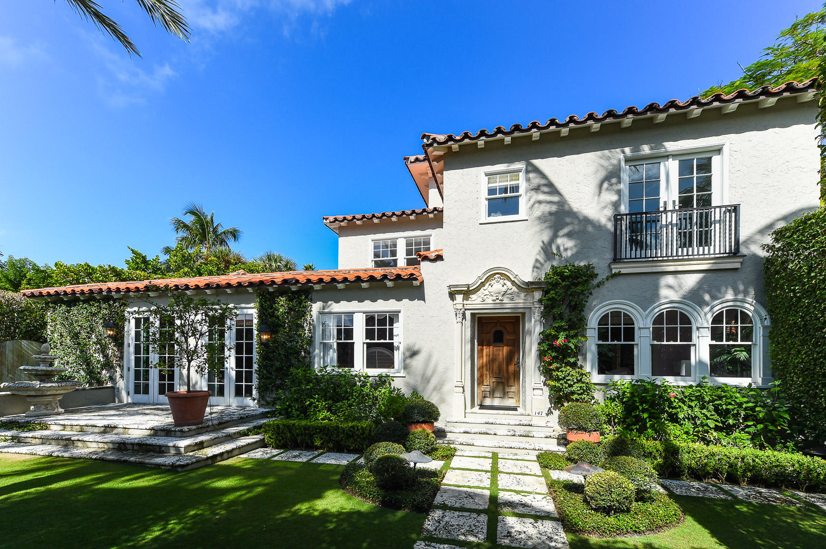 Enchanting 1920's Mediterranean ideally located on the ocean block of the desirable ''Sea'' Streets in town. Gracious living spaces on the 1st floor include living room with fireplace, dining room, family room, office nook, kitchen and cabana bath. The 2nd floor provides 3 large bedrooms with en-suite baths, laundry and hidden staircase to a magical 3rd floor tower room with its own private terrace. Gardens created by Nievera Williams Design complement an oversized pool, covered loggia and 1 bedroom guest house with sitting room and balcony.  Coveted rear service road leads to rare 3 car garage. With over 5,600 sq ft, this beautiful residence will not disappoint with its fresh and light interior perfect for entertaining, family gatherings or enjoying the Palm Beach lifestyle just steps fro the Atlantic Ocean.