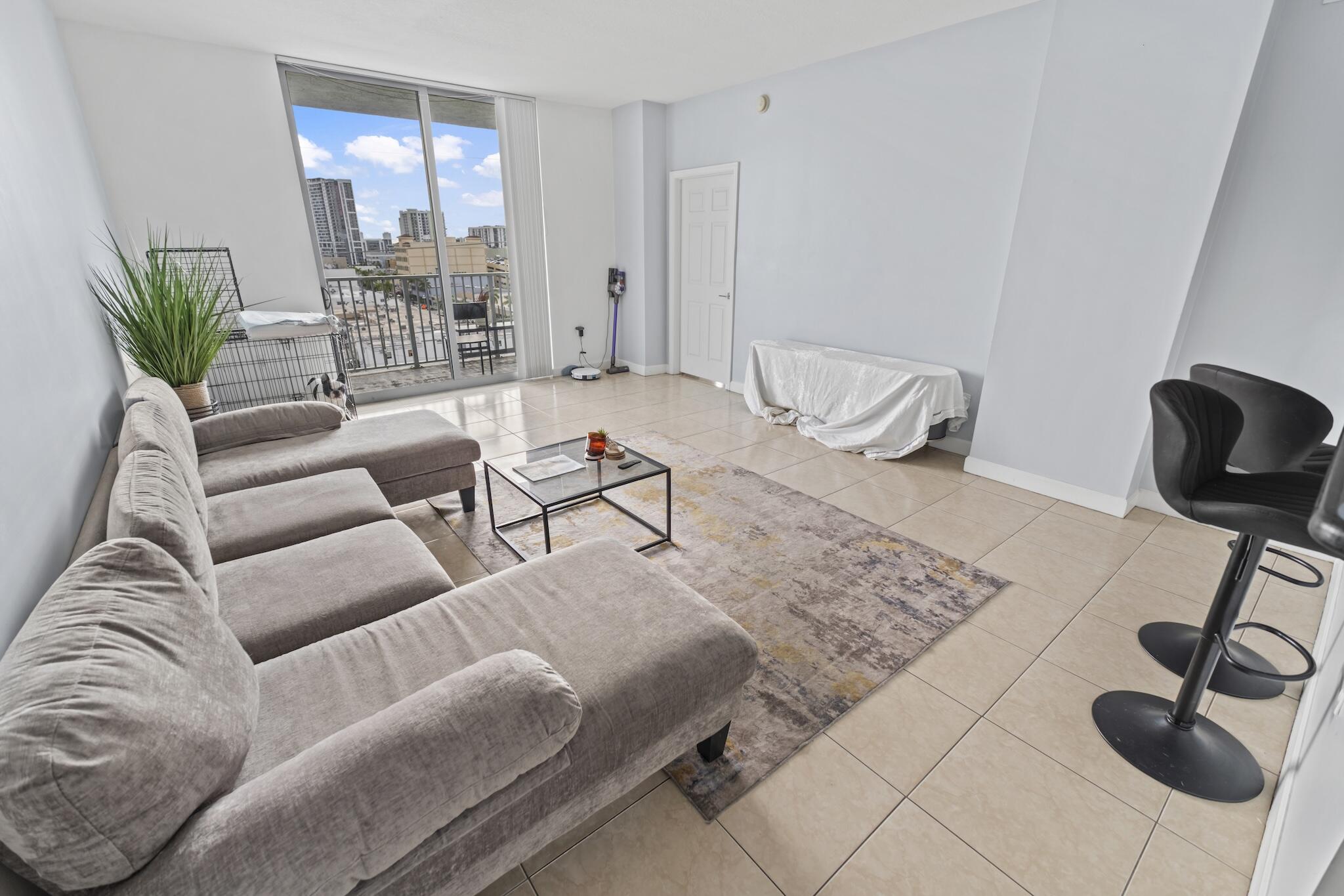 Multiple opportunities in one building offering flexibility for owner-occupants and investors. Spacious 2BR/2BA residence featuring an open-concept floor plan, tile flooring throughout, and abundant natural light. Contemporary kitchen offers wood cabinetry, granite countertops, stainless steel appliances, and breakfast bar seating. Split-bedroom layout provides privacy, with a spacious primary suite featuring dual sinks, soaking tub, and separate shower. Private balcony offers city views. In-unit washer and dryer included. Resort-style amenities include pool, fitness center, secured entry, and covered parking. Conveniently located near dining, shopping, entertainment, beaches, major highways, and Tri-Rail. Excellent opportunity for personal use or investment.   Special Assessment $542.63 per month 120 months
