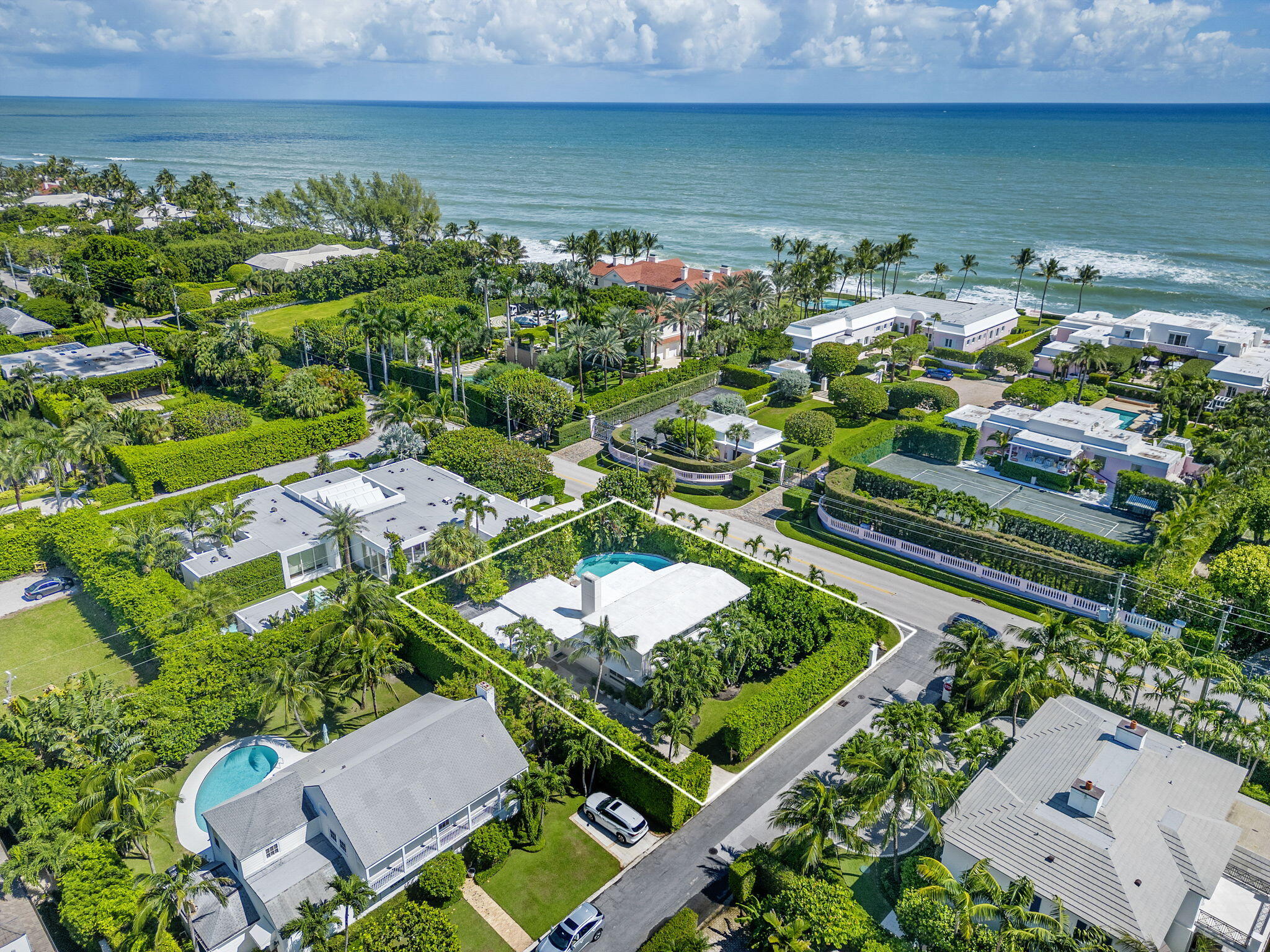 Welcome to 205 Jamaica Lane. This stunning mid-century modern home is situated on a lushly landscaped, 11,000+ sq ft lot on the North End. This architectural gem offers a private retreat with sleek lines, abundant natural lighting, and a a spacious living area with volume ceilings and a sunroom overlooking the pool. Enjoy the North End lifestyle with easy access to the Lake Trail and the widest beaches on the island.