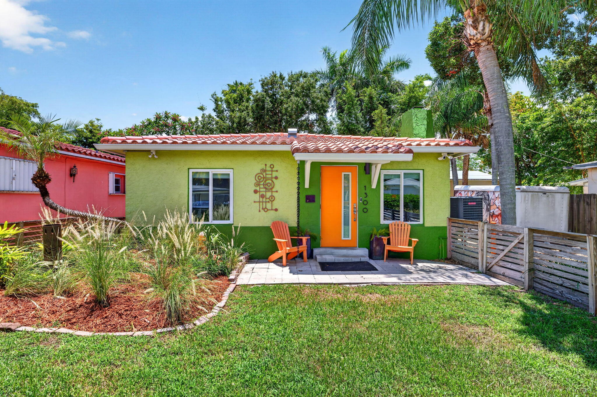 Charming 2-bedroom, 2-bath 1940s updated cottage on an oversized 150-foot-deep lot with room for a pool and future ADU. The distinctive exterior showcases award-worthy urban design and exceptional curb appeal. Inside, the open living and dining area features a vintage wood-burning fireplace and a built-in 5.1 surround sound media system. Imported Italian porcelain tile flows throughout, accented by retro-inspired tile niches, backsplash, and designer details. The yard is a tropical retreat with mature bamboo, raised garden beds, and multiple seating areas—perfect for relaxing or entertaining. Ideally located just minutes from major highways, Fort Lauderdale-Hollywood International Airport, and downtown Fort Lauderdale. Make an appointment today.