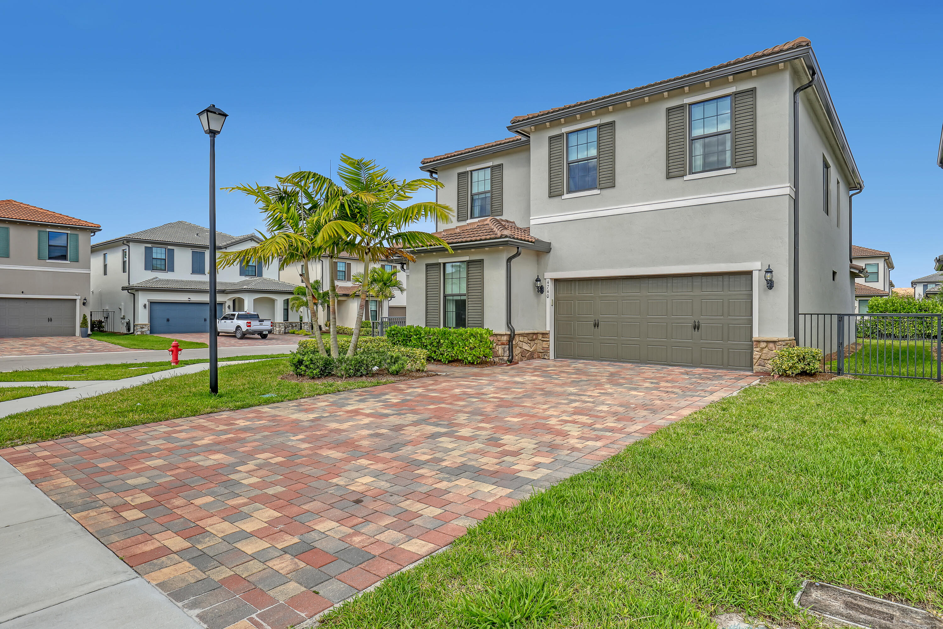 Stunning 2023-built 5-bedroom retreat in the gated community of Fields at Gulfstream Polo. This two-story residence offers 2,645 sq ft of thoughtfully designed living space, featuring a main-level bedroom and full bath, ideal for guests, in-laws, or a home office. The chef's kitchen showcases a large center island, walk-in pantry, and stainless appliances, flowing seamlessly into the open-concept living and dining areas. Upstairs, the spacious primary suite includes a walk-in closet and spa-style en-suite bath, complemented by three additional bedrooms and a versatile loft. Enjoy resort-style HOA amenities including a community pool, fitness center, playground, and park, all within a 24-hour gated enclave. Two-car attached garage, tile and carpet flooring throughout, and tasteful finishes  Stunning 2023-built 5-bedroom retreat in the gated community of Fields at Gulfstream Polo. This two-story residence offers 2,645 sq ft of thoughtfully designed living space, featuring a main-level bedroom and full bath, ideal for guests, in-laws, or a home office. The chef's kitchen showcases a large center island, walk-in pantry, and stainless appliances, flowing seamlessly into the open-concept living and dining areas. Upstairs, the spacious primary suite includes a walk-in closet and spa-style en-suite bath, complemented by three additional bedrooms and a versatile loft. Enjoy resort-style HOA amenities including a community pool, fitness center, playground, and park, all within a 24-hour gated enclave. Two-car attached garage, tile and carpet flooring throughout, and tasteful finishes make this home move-in ready. Zoned for A-rated schools and minutes from shopping, dining, and the Florida Turnpike. Schedule your private tour today.