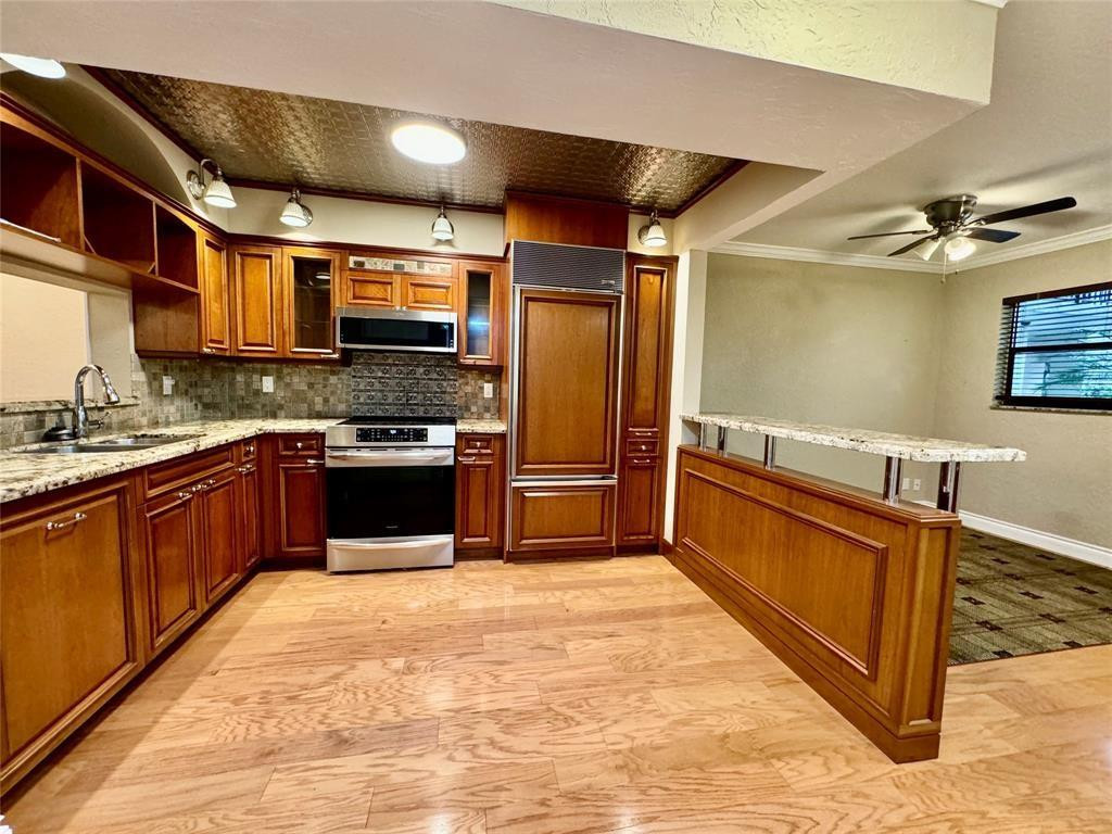 MOTIVATED SELLER! SELLER WILL CONSIDER ALL REASONABLE OFFERS. BEAUTIFUL 2 BEDROOM / 2 BATH SHOWS TRUE PRIDE OF OWNERSHIP! LOCATED ON THE 1ST FLOOR. CUSTOM KITCHEN BOASTS REAL WOOD CABINETS,GRANITE COUNTERTOPS,TIN CEILING,SUB-ZERO REFRIGERATOR/FREEZER,STAINLESS STEEL MICROWAVE & INDUCTION FLAT TOP RANGE. FULL SIZE WASHER & DRYER. GUEST BATH HAS A FRENCH CLAW FOOT TUB. OVERSIZED FRENCH DOORS. WOOD FLOORS THROUGHOUT LIVING AREAS. LARGE CUSTOM CEDAR WALK-IN & LINEN CLOSET. ENCLOSED PATIO WITH POOL & GARDEN VIEWS. GATED COMMUNITY. BASIC CABLE INCLUDED. NO LEASING. 12 MONTHS OF MAINTENANCE FEES MUST BE HELD IN ESCROW FOR 3 YEARS. ***Seller will pay the required 12 months of Condo Association Dues with a Full List Price Offer.***
