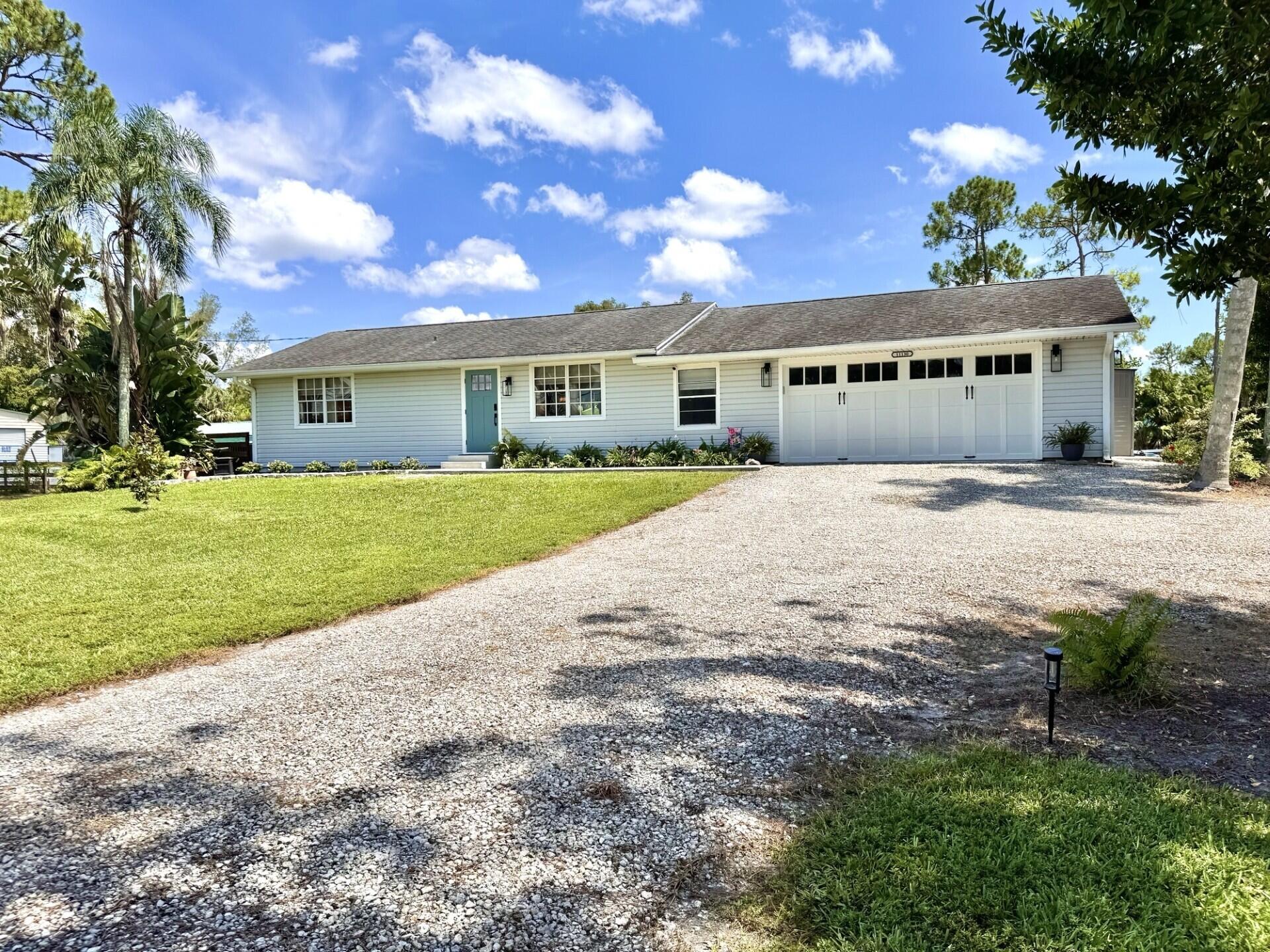 Set on 1.25 private acres, this impeccably maintained 2BR/2BA in a non-HOA area delivers the space, freedom, and lifestyle buyers are searching for. Just minutes from Downtown West Palm, pristine beaches, dining, and shopping. Designed for both relaxation & entertainment, the backyard is a private tropical retreat w/a newer saltwater pool, lush landscaping, and a fully fenced yard. Inside, the home reflects pride of ownership throughout, with thoughtful improvements and meaningful upgrades that enhance both value and everyday living. Car enthusiasts, hobbyists, and entrepreneurs will appreciate the oversized 720 sq ft attached garage, while the additional barn offers exceptional storage and versatility. Combining usable acreage, substantial improvements, privacy, and an unbeatable location, this move-in-ready property presents a rare opportunity to enjoy Palm Beach County living without HOA restrictions.