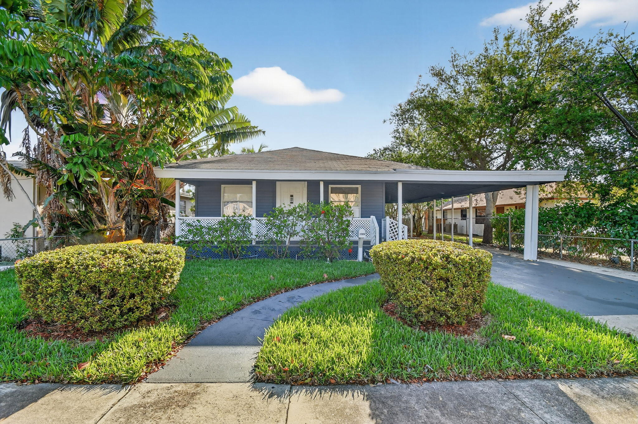 Charming 3 bedroom Lake Worth Beach home sitting on an oversized lot. Step inside this lovely home to find a spacious open floor plan. Light and bright living areas. High ceilings. Large carport and driveway areas provide plenty of parking space. The detached utility building combined with the fully fenced huge lot offer endless potential. Tons of RV/ Boat storage. Possible room for a pool or future expansions. Generous sized enclosed patio. Central A/C. Laundry. This opportunity is perfect for families, first-time buyers, or investors seeking value in NO HOA. Located just minutes from Downtown Lake Worth Beach. Enjoy easy access to shops, restaurants, beaches, parks, I 95, and much more. Call today.