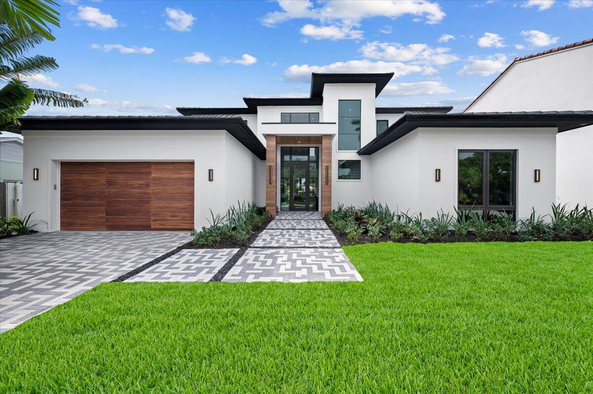 This new construction contemporary home designed and built by Sam Fisch Development is one of five beautiful new homes coming to Ellamar Road in the desirable SoSo neighborhood. The home has 5 bedrooms, 4 bathrooms, and 4,540 sq ft of indoor and outdoor living on a ~10,000 sq ft lot. The first floor primary bedroom and open-concept great room look out onto the saltwater pool and spa with plenty of green space to enjoy. The entertainer's kitchen includes an oversized island and walk-in pantry, and steps out onto the loggia complete with an outdoor kitchen and lots of space for outdoor dining and entertaining.