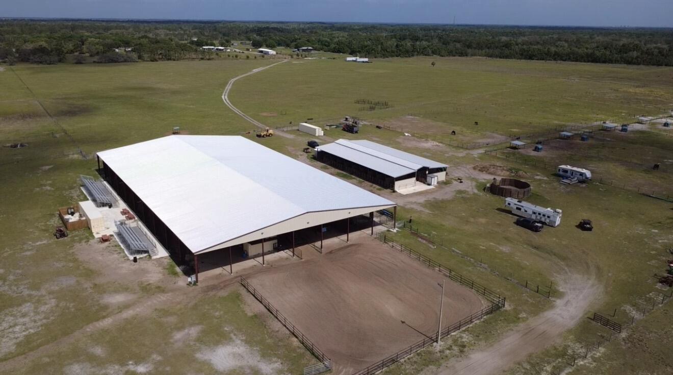 Rare opportunity to own a fully equipped 222.9-acre turnkey rodeo and equestrian facility built for serious operations and large-scale events. This one-of-a-kind property features a covered, lighted 140x250 arena, 6 bucking chutes, and a professional roping chute with box. Entertain and host with ease from the announcer's birdhouse overlooking three sets of bleachers. Designed for performance and capacity, the property includes a 16x32 round pen, 6 fenced pastures, and 16 oversized horse paddocks (approx. 200x100 each). The impressive 18-stall center-aisle barn offers 12x24 stalls, feed room, wash rack, and tack room. Complete with a 12x24 A/C office, full electric, 50-amp service, three septic systems, and five bathrooms. Built for rodeo, training, or income-producing events.   Seller would entertain subdividing 100 acres for 30,000 per acre.