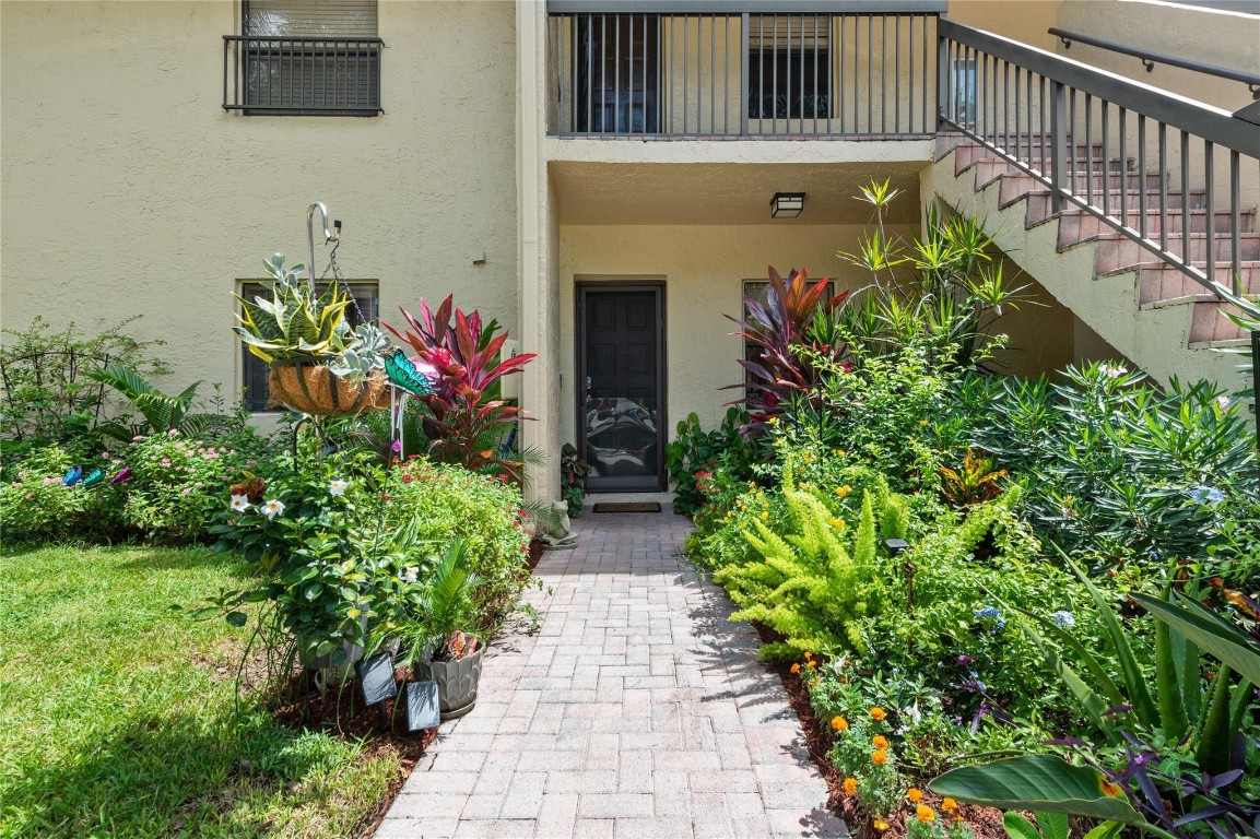 Lovely 2 bedroom, 2 bathroom first floor unit located in The Township of Coconut Creek. Front and backyard landscaping is a gardeners dream. This unit features tile like laminate flooring in the common areas, an open kitchen with white shaker cabinets, quartz counters and stainless steel appliances. Split bedroom floor plan. Large primary room with a walk in closet. Enjoy the peaceful lake view from the screened in patio. Washer/dryer located in the unit. The Township Community offers amazing amenities and activities at the clubhouse that include: gym, library, tennis, swimming pool, theatre, and so much more. All ages welcome! Per association: 650 credit score or higher, no renting, no dogs, no trucks or motorcycles. If financing, 15% down is required by association. 1 parking plus guest.