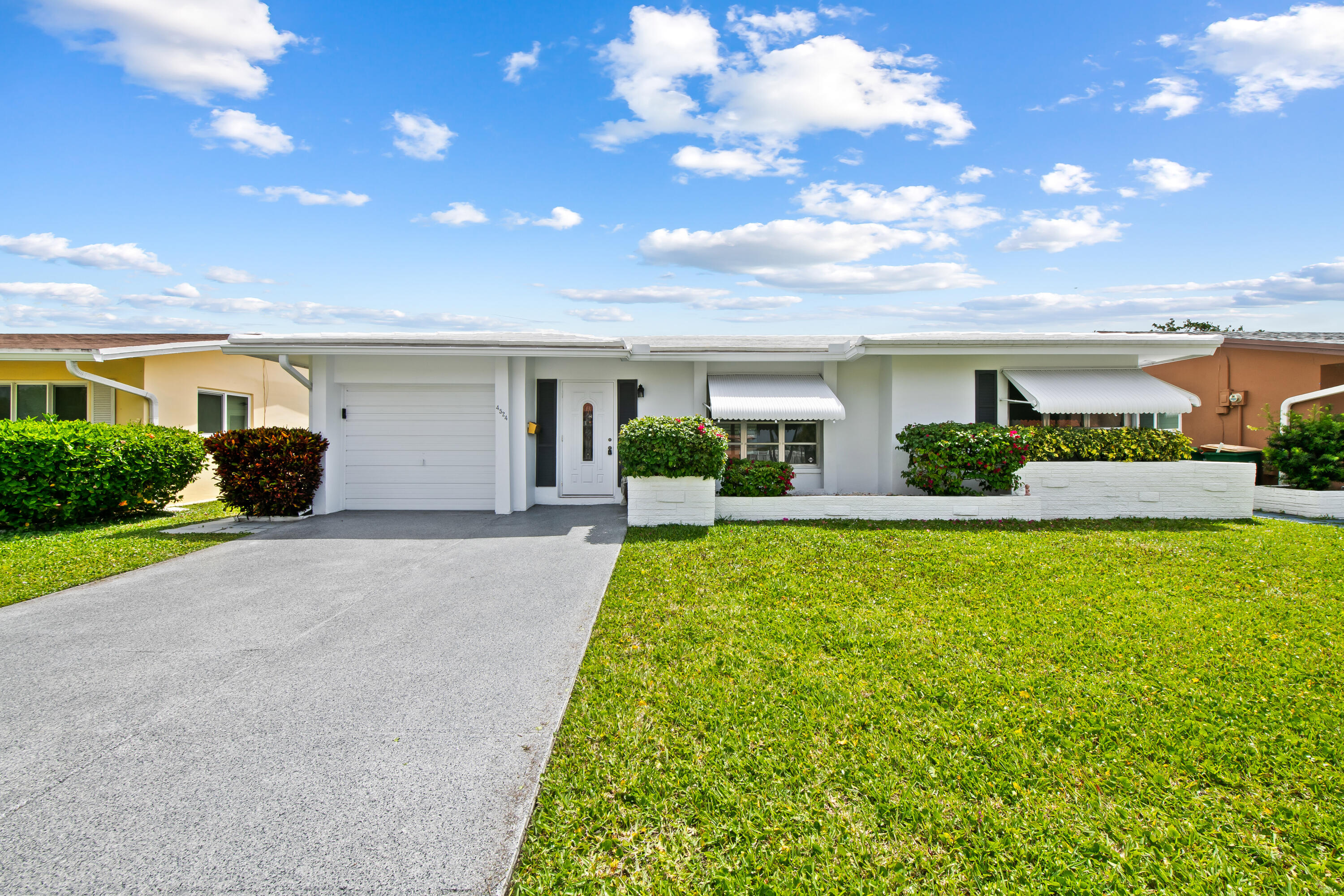 Welcome to this spacious 3-bedroom, 2-bathroom single-family home located in the desirable 55+ community of Mainlands of Tamarac. Ideally situated directly across from the clubhouse, you'll enjoy easy access to the community pool, shuffleboard courts, and a variety of social activities. This well-maintained home features a generous floor plan, brand-new carpeting, and a new A/C system for added comfort and peace of mind. The community itself is centrally located, offering convenient access to major highways, shopping centers, and dining options. Residents benefit from low association fees and a quiet, well-kept neighborhood atmosphere. Per HOA: one resident must be 55 years or older (no residents under 18 permitted), minimum credit score of 725, minimum annual income of $40,000.