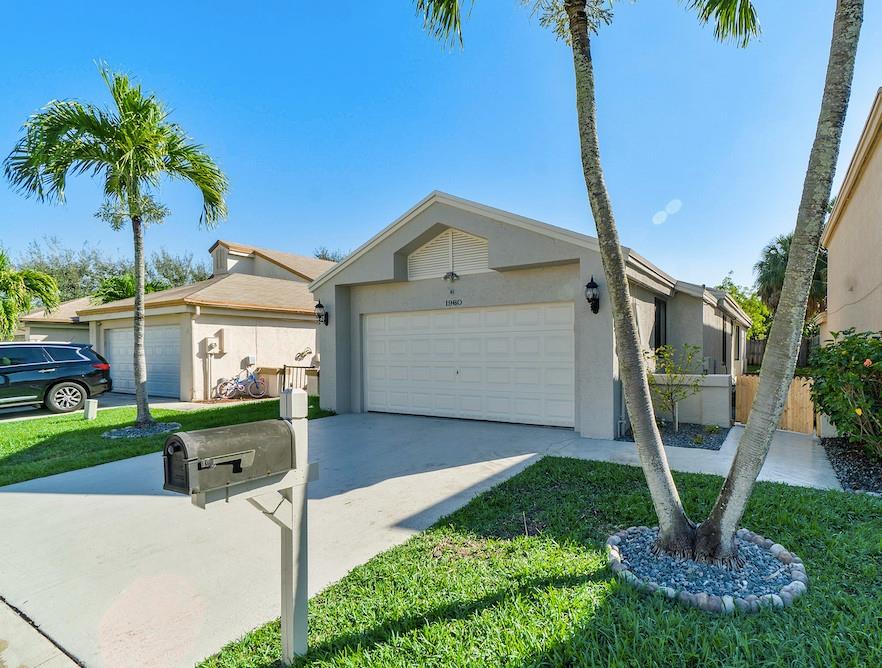 Wonderful updated single family home 3/2 with 2 car garage located in man-gated community of Centura Parc in beautiful Coconut Creek. The house features tiles throughout the living area and laminate in bedrooms, updated kitchen with granite counter and newer appliances. Bathrooms completely updated as well! Large & private screened patio and perfect backyard with plenty of room for the kids to play & the dog to run around! Impact windows. New washer/dryer. Centura Parc spacious clubhouse offers many activities with an oversized pool, tennis courts, basketball courts, sauna, social room, playground and more. Low HOA fees also includes internet and cable too.