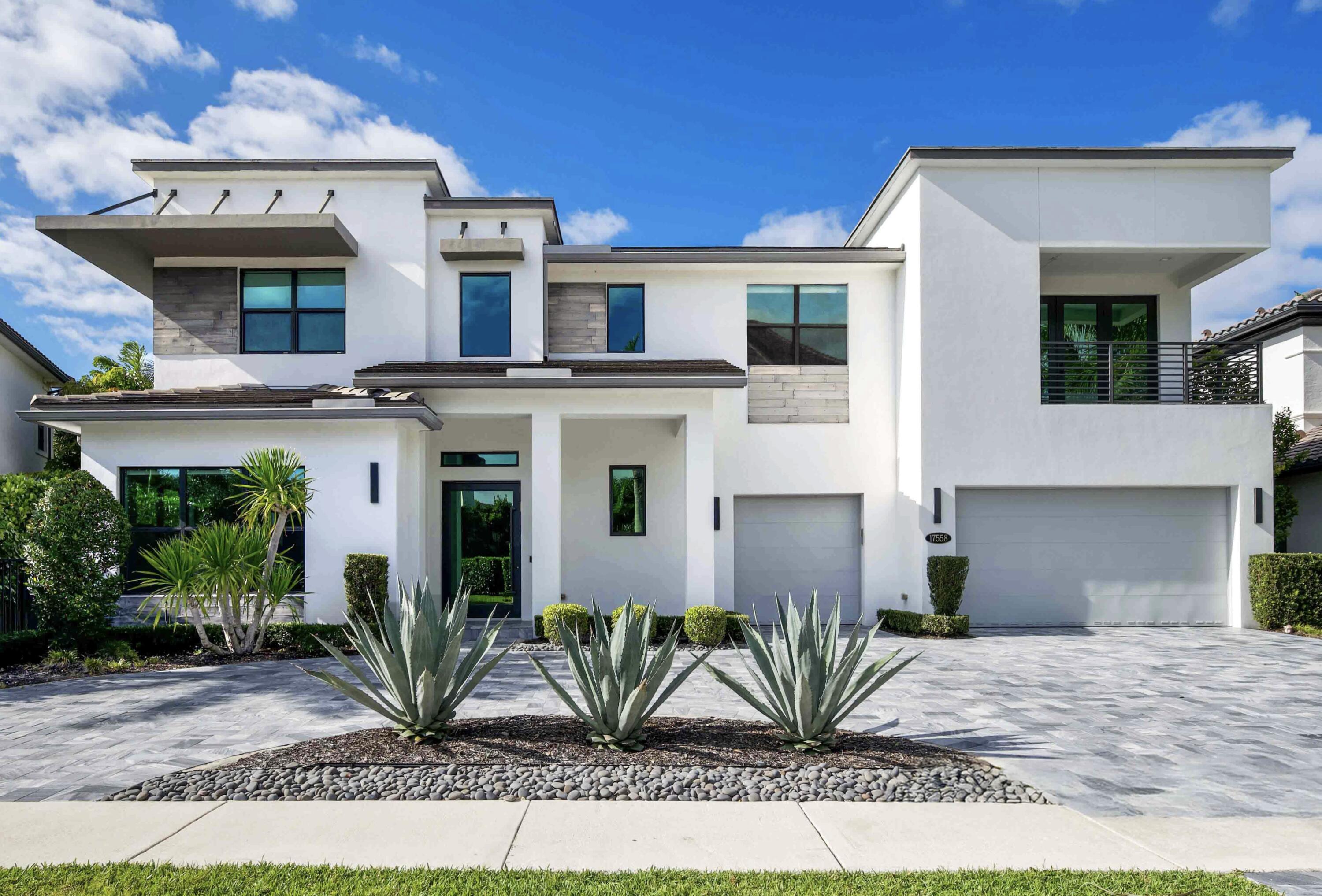 The last home built in The Oaks in 2019, this contemporary estate is a true architectural showpiece in one of Boca Raton's most coveted communities.  Featuring 5 bedrooms and a gym that can easily serve as a 6th, plus an office and a media room with surround sound and a wet bar, this home was designed for elevated living and effortless entertaining.  Set on a private .26 acre lot, the backyard is nothing short of spectacular, complete with sandblasted marble pavers, a covered lanai perfect for outdoor dining, and a salt water pool and spa surrounded by meticulous landscaping.  From the moment you enter through the custom glass pivot door, you're greeted by the exceptional design, including a dramatic glass winding staircase, curated wine storage, and a chef's kitchen with a large island,  with waterfall countertops, top of the line Wolf and SubZero appliances, and both a butler's pantry and custom walk in pantry.  With 5,336 square feet of living space, the primary suite is a true sanctuary filled with natural light, breakfast bar and features a spa like bathroom and dual dressing rooms.  A marble drive way, 3 car garage, impact windows and doors, and generator complete this extraordinary residence.
