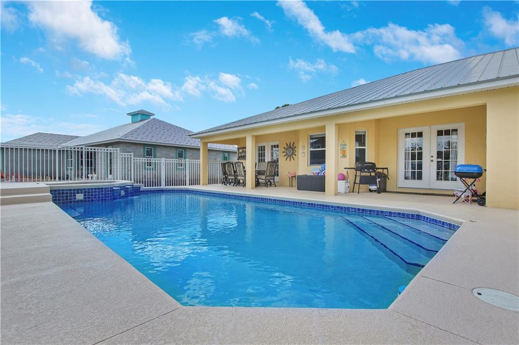BACK ON MARKET! BUYER FINANCING FELL THROUGH! CBS 4/2 & 3 car garage pool & spa home sits in the heart of Port Saint Lucie. This home is perfect for entertaining with a large living area that overlooks the beautiful large lot &  pool. This move in ready home has a metal roof & sits on an oversized corner lot. This home features a WHOLE HOUSE GENERATOR, newer AC & appliances. NO HOA!