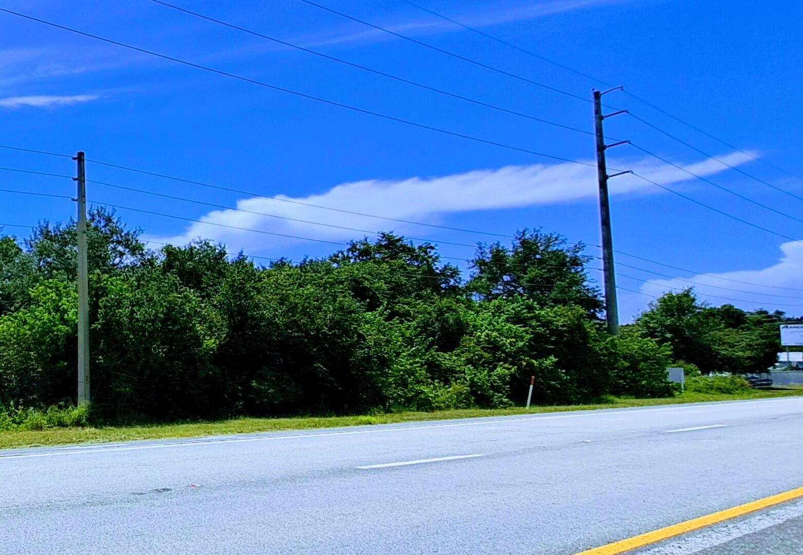 High-Visibility US1 Development Site Located Just 3 Miles from Treasure Coast International Airport - Ideal for Storage, Flex industrial builders, local contractor companies scaling up, small logistics companies, aviation-related service operators or Service Commercial Use. This operationally strategic Dual-Zoned Development is ideal for low-water demand commercial uses and priced below improved comparables, creating immediate built-in equity and margin for the buyer. Strategically located near established and growing communities including Lakewood Park, Holiday Pines (golf course community), Spanish Lake Fairways, Waterstone and the Lennar community bringing 650 new homes nearby.