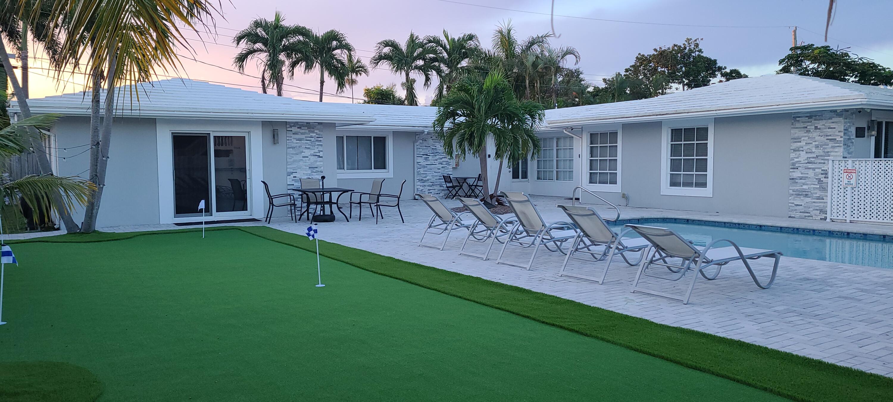 Rare opportunity to own a fully remodeled, income-producing multifamily property in Fort Lauderdale! This duplex with an additional efficiency unit and shared heated pool offers multiple income streams and flexibility for investors or multigenerational living. Fully furnished and turnkey, the property operates as a professionally managed vacation rental with a 4.8-star Airbnb rating and is approved for short- and long-term rentals. Renovated in 2022 with updated electrical systems, stainless steel appliances, modern finishes, smart home technology, and security system.  Prime location near restaurants, businesses, and minutes from the beach. The spacious outdoor area includes a heated pool and inviting patio.