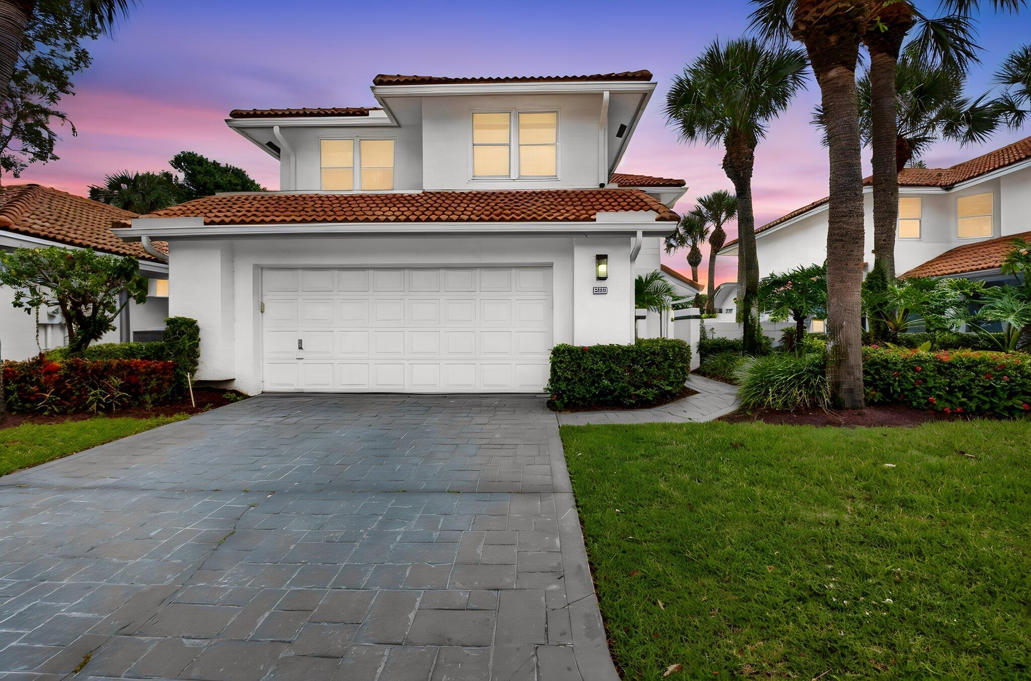 Exclusive Broken Sound Club & Golf Community! Stunning fairway-front property in Cedar Cay offering approx. 2,300 SF of living space. This 2-story residence features 3 BR, 2.5 BA plus a flex space  ideal as a 4th BR, office, gym, or study. Soaring ceilings, impact-rated vinyl doors and double-hung windows, Italian porcelain tile throughout, glass stair railings with accent lighting, glass interior doors, and a custom front entry create a sleek contemporary design. The gourmet kitchen and laundry feature European-style cabinetry, Taj Mahal quartz countertops with waterfall edge, new appliances, designer lighting, and custom window treatments. Additional upgrades include an EV charger, epoxy garage floor, and new gutter system. Resort-style backyard boasts a pool and spa with new French-pattern sandblasted White Ice marble decking, new Diamond Brite finish, updated tile, and screened enclosure. Spectacular golf course views complete this exceptional property. Easy to show—schedule your private tour today!   Located within the prestigious Broken Sound Country Club, residents enjoy access to a world-class lifestyle featuring championship golf, tennis, pickleball, fitness facilities, spa services, fine and casual dining, social events, and a vibrant year-round club atmosphere through the club's mandatory membership program. Cedar Cay is one of Broken Sound's most sought-after villages, offering a picturesque setting with beautifully maintained landscaping, quiet streets, and stunning golf course views. Conveniently located near shopping, dining, entertainment, major highways, and Boca Raton's beautiful beaches, this home offers the perfect blend of luxury, recreation, and convenience.