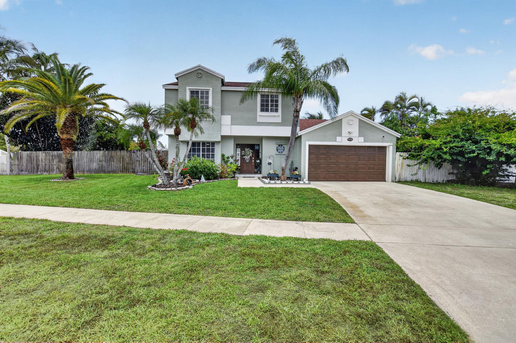 Bright and spacious two-story home features an open layout designed for comfortable everyday living and effortless entertaining. Highlights include a large enclosed patio, an expansive primary suite, and abundant closet space throughout. Situated on an oversized corner lot, the property offers privacy, beautiful landscaping, and a private pool. The living and dining areas feature tile flooring and generous space for both daily living and hosting guests, making the home ideal for families or couples alike. The living room opens to a large screened patio and private backyard with a pool, creating the perfect setting for outdoor entertaining.  Low HOA fee which includes cable/internet, trash removal & lots of amenities such as: a clubhouse, pool, tennis courts, playground, & basketball courts. Conveniently located near top rated schools, major roads, shopping, dining, and entertainment.