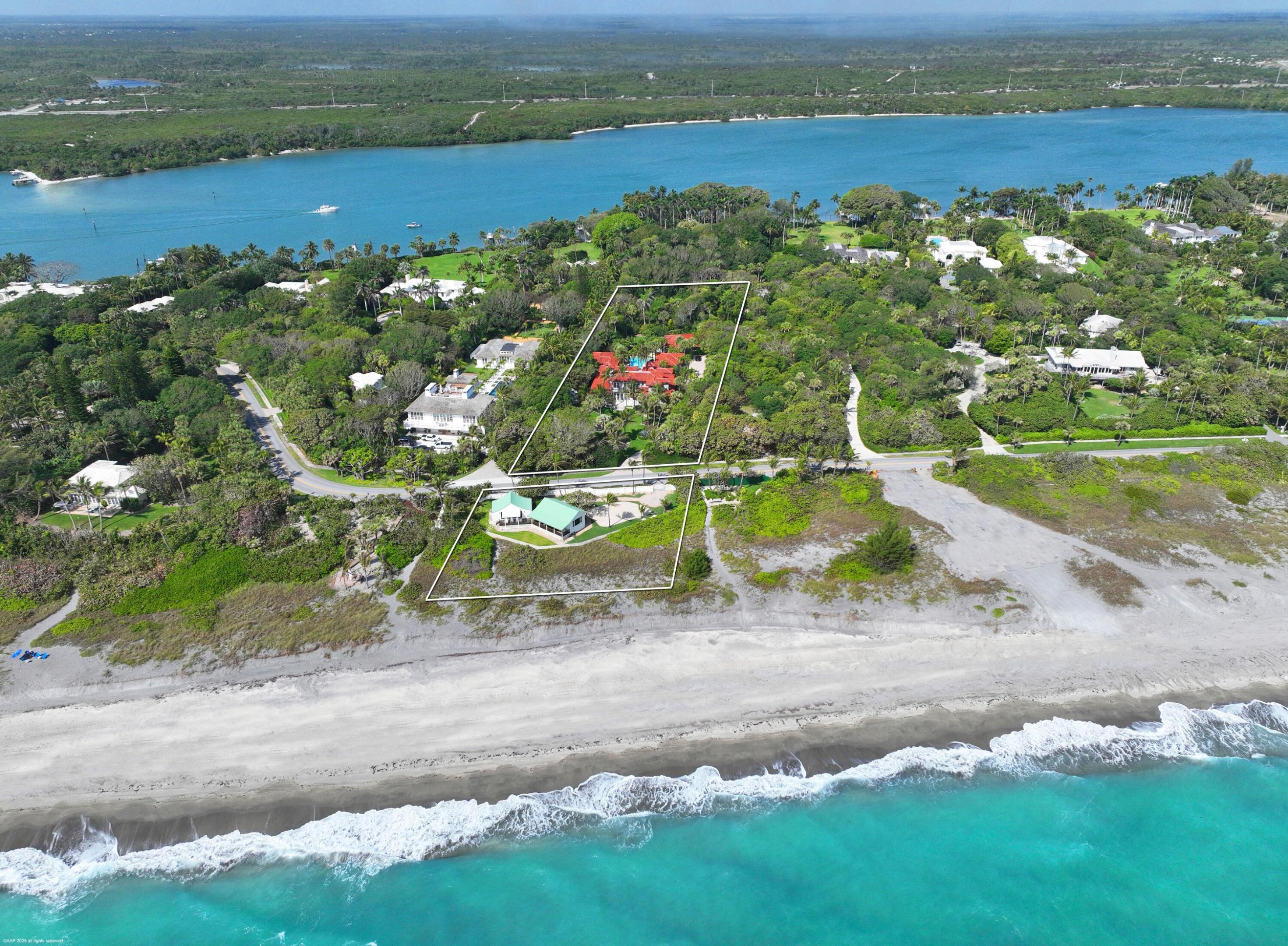 ''Mermaids Landing''  is a rare oceanfront jewel which has been meticulously maintained since a complete renovation in 2012. Located on a lushly landscaped 2.45 acres with two oceanfront beach cottages on 165' of private shoreline this home is a stunner. 5B/7.2B; propane fireplace, custom wood paneling and trim throughout, heated resort style pool with fountain, gigantic pool house with chefs kitchen, second floor primary bedroom suite with commanding ocean and pool views, twin balconies and elevator. Wet Bar, wine cooler, formal dining room, impact windows and doors, electric black out shades.    Two Guest houses on an elevated dune with kitchen, bath, fireplace and covered teak porch to enjoy the ocean breezes. An incredible opportunity for the best Jupiter Island has to offer.  Main home was built in 1998, completely renovated in 2012, with further improvements  made in 2017. Beachfront  cottages were built in 1940's with major structural improvements done in 2004.
