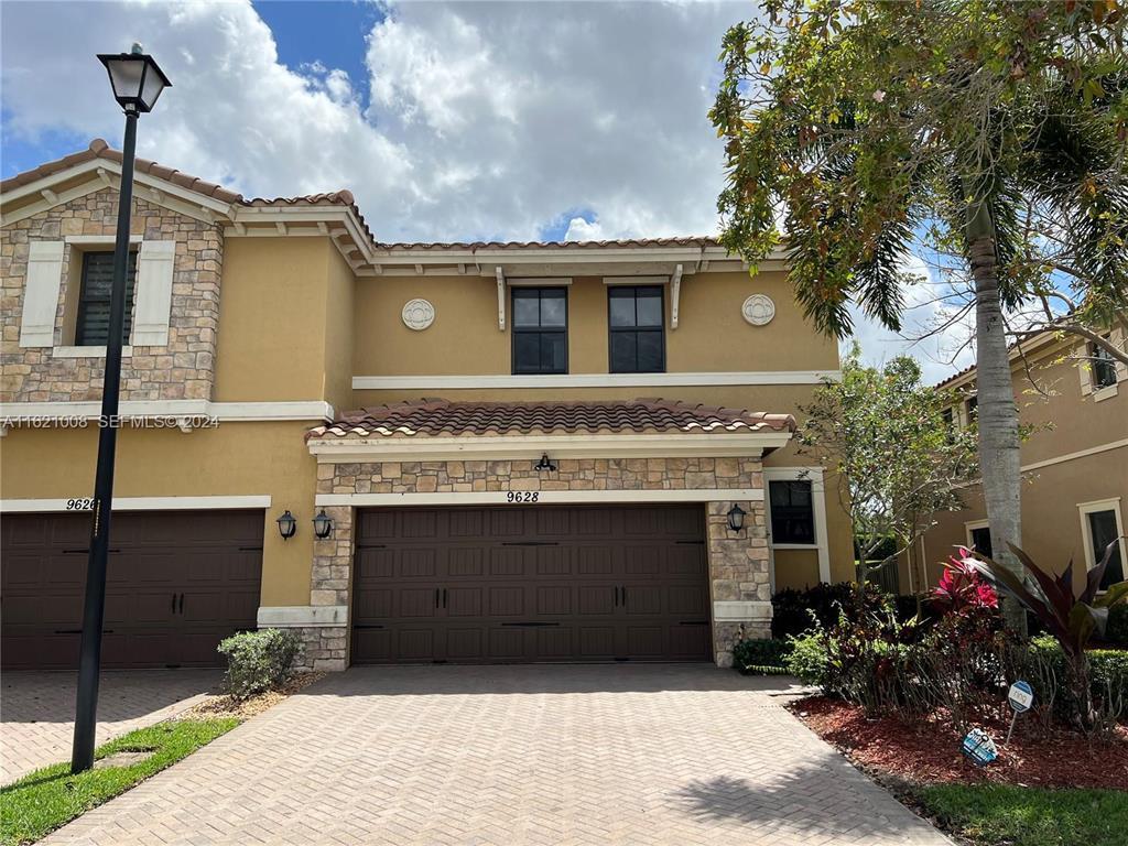 Resort-style living in highly sought-after Town Parc! Rarely available, bright 3BR/2.5BA corner Builder's Dream model packed with upgrades. Private entry and extended backyard. Features include 42" espresso cabinets, granite countertops with backsplash, GE stainless steel appliances, wood floors, crown molding, surround sound, and custom mirrored accent wall. Redesigned pantry opens to kitchen. Real wood staircase leads to second floor with custom closets and designer window treatments. Large upstairs laundry, water softener, and freshly painted interior. Impact windows throughout. 2-car garage with epoxy floors + 2-car driveway and guest parking. Across from amenities with access to Mira Lago & Cascata: resort pool, splash park, fitness, tennis, basketball, clubhouse, A-rated schools. Features Include Corner Unit, Wood Floors, Custom Mirror in Living Room, Large Kitchen w. Redesigned Pantry Opening Inside Kitchen Instead of in Family Room, Espresso Cabinets, Granite Countertops, Custom Closets Throughout, Designer Window Treatments, Extended Backyard, Corner Unit w/ Private Entry, 2 Car Garage & 2 Car Driveway, Extra Guest Parking, Across from Town Parc Amenities, Large Laundry Room Upstairs, Pristine Condition and Move in Ready, Recently Painted Interior, Access to Mira Lago and Cascata's Resort Style Amenities, Pool, Splash Park, Fitness Center, Basketball, Tennis, A Rated School