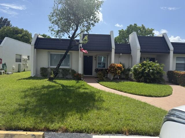 This 2/2 convertable villa in Ph B of Golden Lakes has a enclose updated Florida Room with impact windows and new door leading to a tree lined canal. The kitchen has been updated and has a stand alone shower, a washer & Dryer and newer . There is a satellite pool at the end of the street  and the main clubhouse is just minutes away, This community has tennis and pickleball courts, a large pool and hot tub. It has a new stage, dance floor, and tiki hut for outdoor parties. Just minutes from the highways & turnpike and the airport. The beaches are 20" away. We have line dancing, zumba, water and floor exercise classes and many other activities
