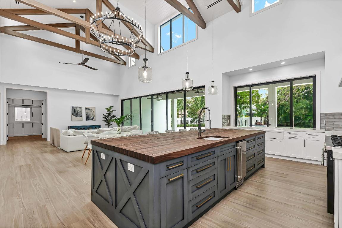 Explore an extraordinary residence in the coveted Jupiter neighborhood of Pennock Point! Built in 2025, this Coastal farmhouse single story home with 4 bedrooms, 4.1 bathrooms, and a spacious 3-car garage seamlessly balances elegance and functionality. With 24ft-soaring ceilings & designer beans, the main living area, dining room and kitchen is the focal point of this functional home. The gourmet kitchen is a chef's paradise, with high-end appliances, including a oversized 60-inch gas range, oversized butcher block countertop double sinks, custom cabinetry throughout, and plenty of storage with a huge pantry. The open layout allows you to engage with guests while preparing culinary masterpieces. SEE MORE... The smooth transition between indoor and outdoor spaces fosters a warm and inviting environment ideal for hosting gatherings. The oversized mudd room, and spacious laundry room with plenty of storage.

Step through the sliding glass doors to discover a stunning outdoor entertainment area. The inviting pool serves as a perfect retreat for relaxing on sunny days, while the generous patio is ideal for sunbathing, unwinding, or hosting unforgettable al fresco dinners under the stars. Surrounded by lush landscaping, this outdoor oasis offers tranquility and privacy.

The location of this home is simply unmatched. Enjoy the convenience of being just moments away from shopping centers, fine dining, and top-rated medical facilities. For those on the go, easy access to major airports, I-95, and the Florida Turnpike makes commuting a breeze, giving you more time to enjoy the comforts of your new home.

One of the standout features of this property is its proximity to both the beach and downtown Jupiter. In just a 5-minute drive, you can find yourself on the soft sands and enjoying the refreshing coastal breeze. Downtown Jupiter is a lively hub filled with entertainment options, from boutique shopping to delightful cafes, ensuring there's always something new to discover. Whether you prefer a leisurely waterfront walk or a fun night out with friends, the opportunities are limitless.

This premier property in Pennock Point is not just a home; it represents a lifestyle defined by luxury, convenience, and the stunning beauty of its surroundings. With its impeccable design, superior amenities, and prime location, it exemplifies gracious living. Don't miss your chance to make this exquisite pool home your own and step into the lifestyle you've always dreamed of. Your ideal life awaits!