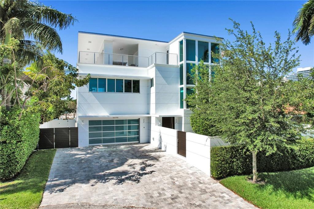 Magnificent 3-story contemporary designer home, next to Intracoastal. 80 ft concrete dock. 3 blocks from the beach, and close to Hugh Birch Park, this stunning 8 suites ( luxurious double master + 1 ground floor junior master) home has it all. Built with high-quality construction and finishes, such as Vantage lighting, custom Wenge cabinetry, easy-care porcelain tile, impact glass, gourmet kitchen, and premium appliances. The gated front yard leads to a massive Mahogany front door, opening onto a welcoming foyer, with open plan living/dining giving onto the gourmet kitchen and walk-in pantry. 10 ft sliding doors open onto a wide covered patio and grill and 60 ft heated pool. By the stairs, an elevator takes you to the 3rd-floor room and a stunning wrap-around terrace with support kitchen. Local contractor quotes are available for a possible future boat lift installation for the property.One of the second-story rooms is presently a fully equipped professional gym. Another suite is presently a home office but easily reverts back to a bedroom suite. The main master has 2 separate walk-in closets and the large bathroom has a double shower with a steam bath.No pet restrictionsAll measurements are believed accurate but have not been verified.*video tour:https://www.dropbox.com/s/jwlc7apgcybj8fy/Video%20Tour.mp4?dl=0