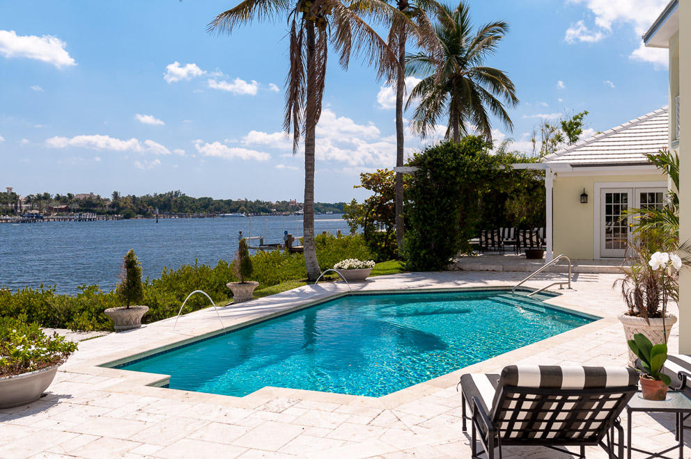 Overlooking the wide waters of the Intracoastal, 1630 Land’s End Road offers 133’ of the most beautiful water views in the tranquil setting of Point Manalapan. Owned by a renowned designer, this 6,775 sq. ft. home provides 6 BR, 7.5BA and many great features including a grand foyer, spacious gourmet kitchen, expansive sitting room with large screen TV and fireplace, formal dining room, elegant drawing room and master suite all opening to the east-facing terraces with spectacular views.  There are four additional downstairs en suite bedrooms (one with separate entrance) and an alternative master suite and media room on the second floor.   Private dock, two car garage and gratis membership to the La Coquille Club at Eau Palm Beach Resort & Spa (formerly the Ritz Carlton).  $4,595,000