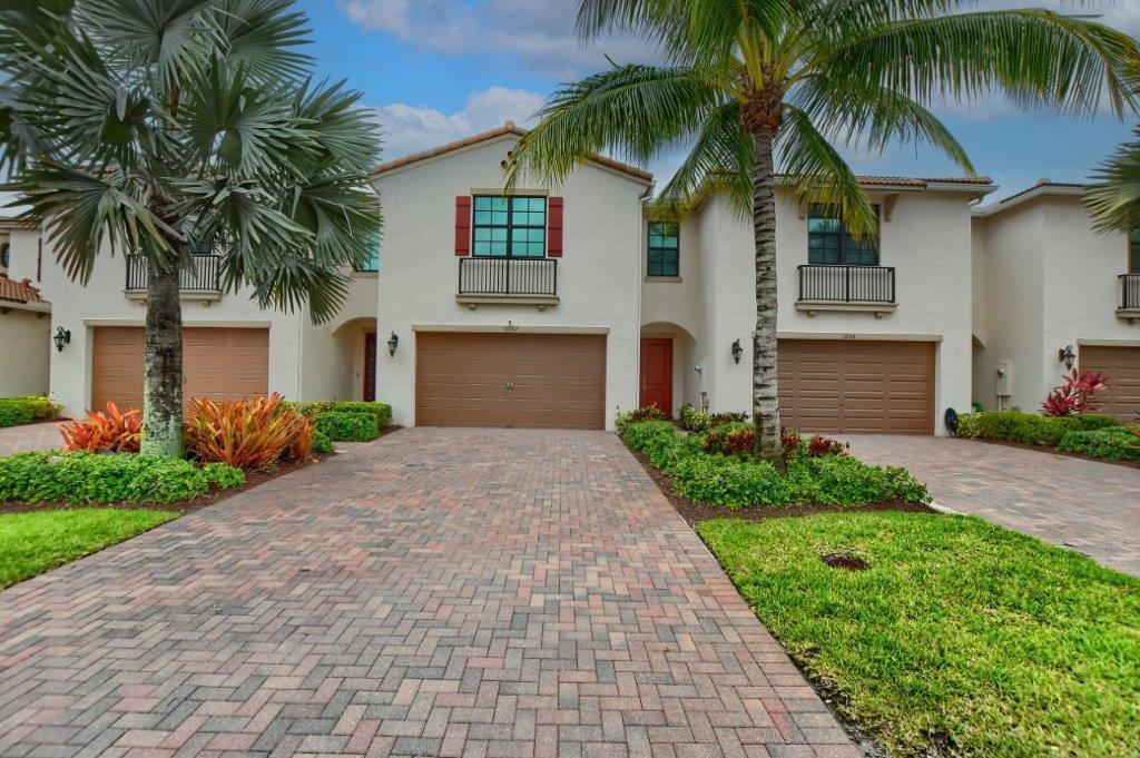 Welcome to paradise! This upgraded Townhouse located in the popular private gated community of Enclave at Boca Dunes. Enjoy maximum seclusion and privacy while you relish breathtaking  tranquil direct lakefront and golf course views in your fully screened in patio! Featuring a wide open floor plan with high soaring ceilings  capturing the sensational view of the lake and golf course! This flowing floorplan with eat in kitchen is a perfect design for every day easy living. Spacious master suite offers two walk in closets. Large two car garage with an extended driveway offers plenty of room for the extra cars you might need. RESORT STYLE LIVING at the the Boca Dunes offers clubhouse, pool, spa, fitness center, billiards and playground! LOW HOA FEES TOO! Conveniently located! A true gem!