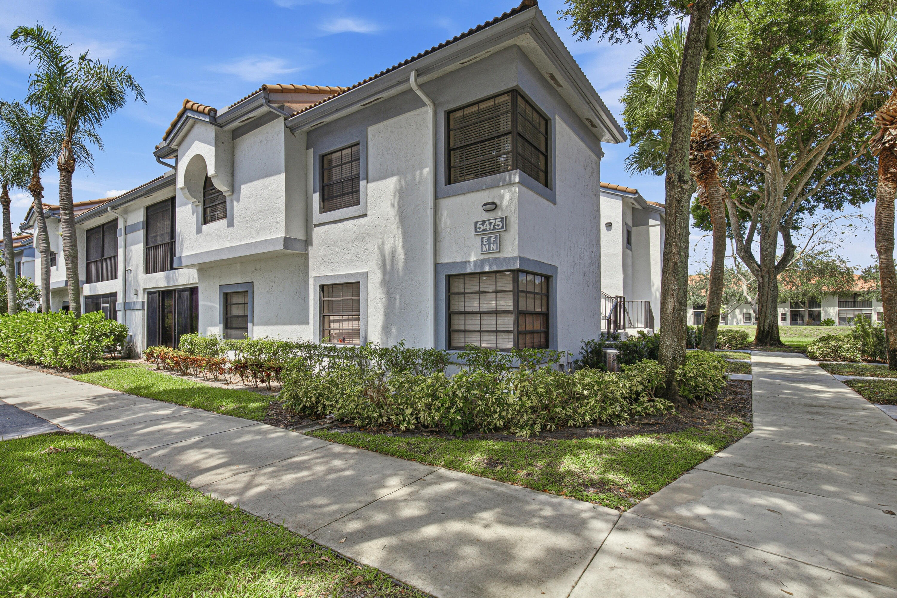 True 3/2 ground-floor condo in the highly desirable all-ages Platina community! This turnkey home is fully furnished with high-quality pieces and ready for you to move right in. Recently renovated, the interior features newer luxury plank flooring and an open-concept kitchen complete with granite countertops and upgraded cabinetry that flows seamlessly into the main living space. Both bathrooms have been tastefully updated with new vanities and refreshed showers. Includes an in-home washer/dryer and dishwasher.  Step through the sliding glass doors into your bright, enclosed Florida room to enjoy a peaceful, private green space with serene, direct views of the canal. Located in an excellent school district and offering an effortless, low-maintenance lifestyle, just bring your toothbrush!