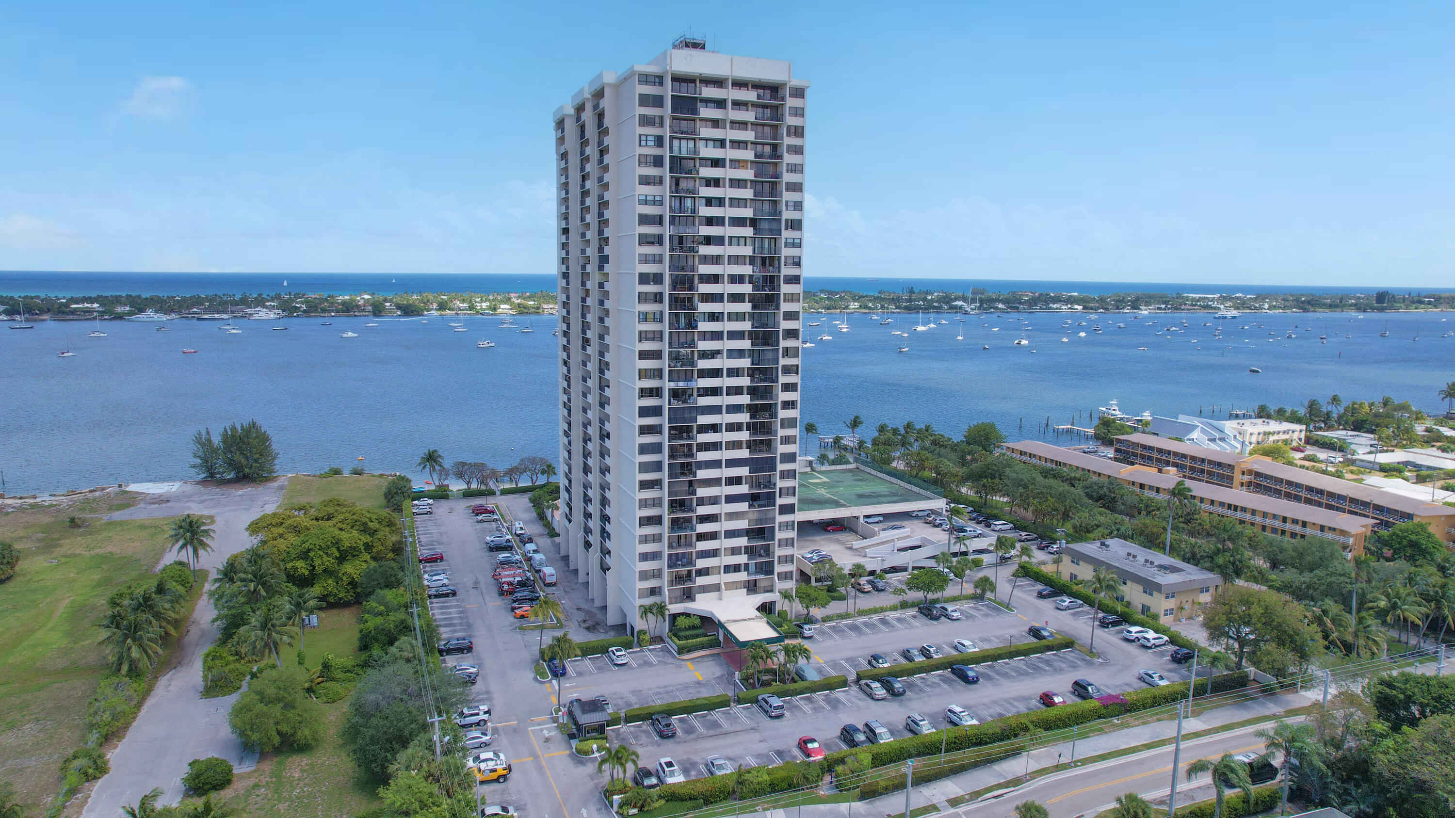 Amazing investment opportunity in West Palm Beach! Seller has paid entire assessment. Updated, two-bedroom, two-bath condo offers beautiful city/sunset views from the 15th floor.  Featuring wood laminate floors and tile throughout. New Stainless appliances. Accordion Shutters. Enjoy resort-style amenities, including a private beach exclusive to this building, a spacious balcony, and a washer/dryer in the unit. The complex also offers a saltwater heated pool, a state-of-the-art fitness center, tiki hut, and beachside barbecue area. Cable, high-speed internet, and water are included in monthly maintenance. Fishing Pier. Moor your boat in front of building Assigned parking & Additional storage comes with the unit, one pet is allowed. This condo is situated in a prime location. It is also conveniently close to fabulous shops, restaurants, downtown WPB, Palm Beach Island, Nora District and Palm Beach International Airport.