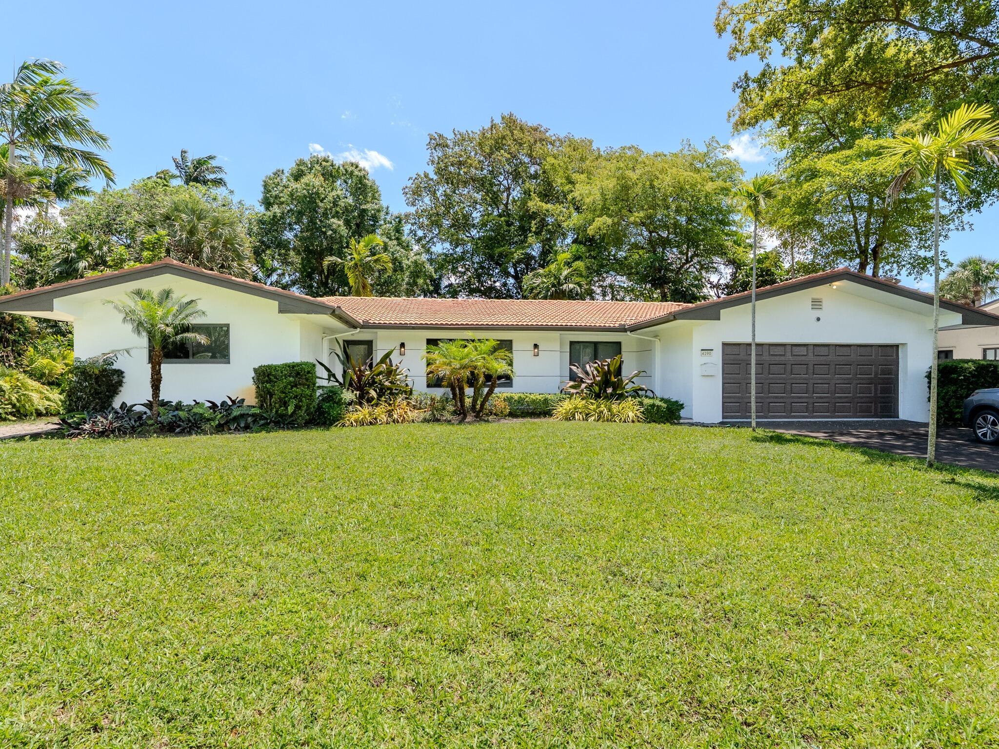 Welcome to this spacious 3-bedroom, 2-bathroom home situated on a massive lot in the heart of Plantation. Boasting a functional layout with a stacked bedroom plan and a versatile den perfect for a home office.  The interior features elegant marble flooring throughout the main living areas. Significant upgrades include a barrel tile roof and a 2-car attached garage. The expansive backyard is fully fenced, providing a private oasis with ample room for outdoor living or parking multiple vehicles/boats. Located in the desirable Country Club Estates with no HOA, you are minutes from top-rated schools like Plantation Park Elementary. Sold As-Is. Don't miss this incredible opportunity!