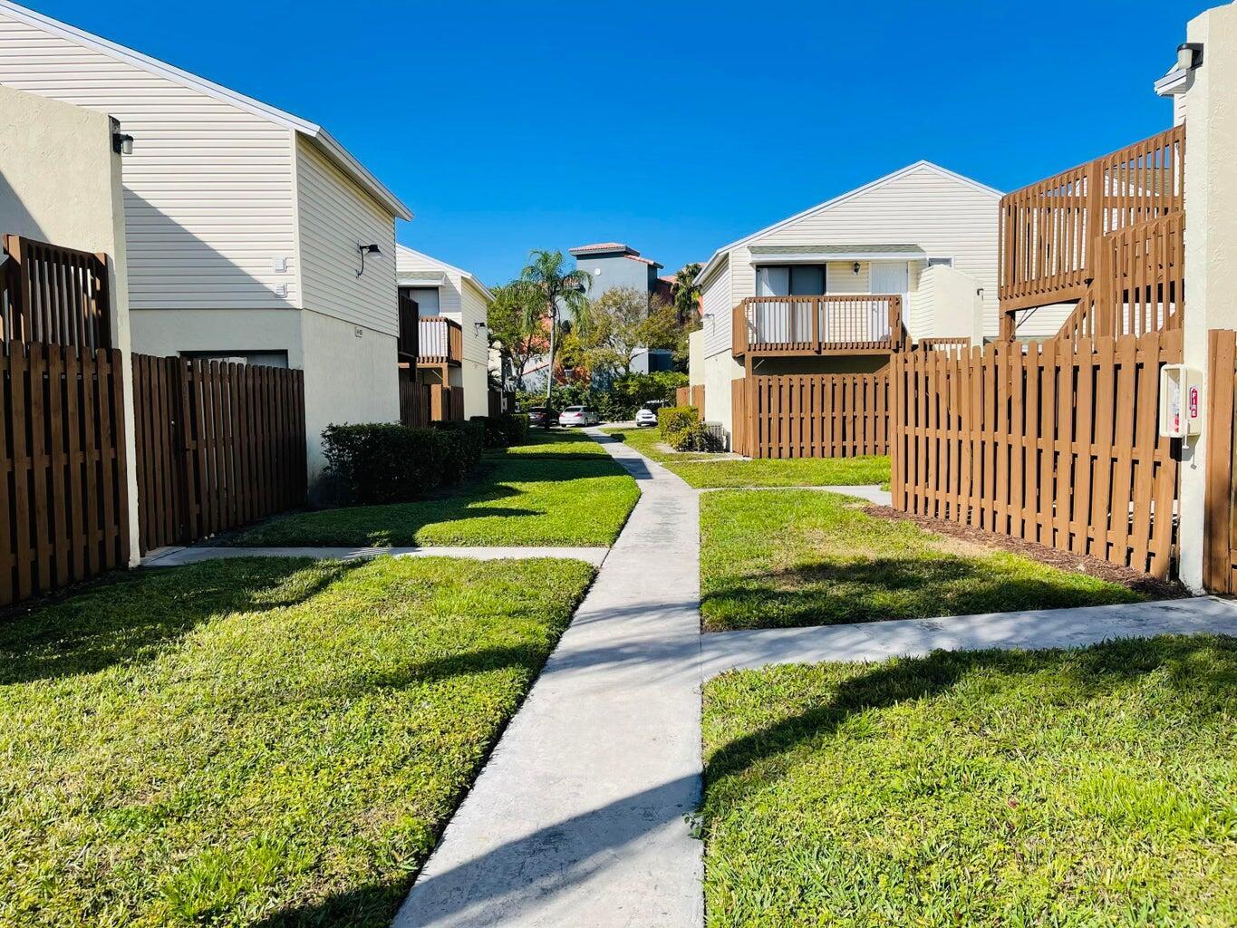 Spacious first-floor one-bedroom unit featuring all tile flooring throughout and an in-unit full-size washer and dryer. Located in a gated community with assigned parking and a community pool. Association fee includes water, trash, basic cable, common area maintenance, and grounds maintenance. Roof Installed 2024. Property can be rented immediately, making it a great option for both homeowners and investors. Conveniently situated close to I-95, shopping, restaurants, and public transportation, and just minutes from Palm Beach Outlets, the beach, and Rosemary Square. Excellent location with easy access to everything West Palm Beach has to offer