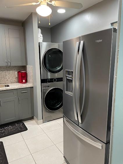 Wow!  This is it! Very Spacious 1st floor Condo with Parking in front of your unit.  Newly Remodeled Upgraded Open Kitchen with LG Washer + Dryer, All New Whirlpool SS Appliances, Granite Counters, Stove, Microwave.  Beautiful Shaker Cabinets, high hats lighting + Fan.  All Tiled Flooring throughout.  Screened Patio with door and  Electric Storm Shutters.   2nd Bathrm totally upgraded with White Shaker Vanity, Tile walls, faucet, mirror + lighting.  Mstr Bathrm has pretty blue + white tiles, shower with tub.  Mstr Bedrm has  2 hugh walk in closet.  Hugh clubhouse with oversized heated pool, billiard room, library, exercise room, ball room, shuffleboard and more.   Walk to Public shopping center, less than 1 mile to the Beach, mins to Ft. Lauderdale Airport, and I -95.  Ideal Location!!!