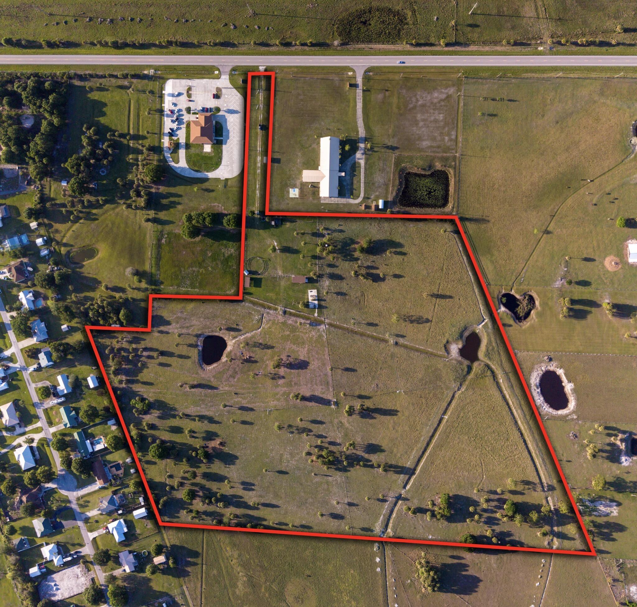 Versatile ranch property offering both rural living and future development potential. Pre-approved for up to 10 residential homesites, each over 2 acres—ideal for a private estate, family compound, or investment opportunity. The fully fenced land includes water and electric service, along with two barns (20x35 and 10x10), a cow pen, and chicken coops. A 25x40 concrete RV pad with septic is already in place, allowing for immediate use or temporary living. With key improvements and approvals complete, this property is well-suited for agricultural use, equestrian living, or residential development.