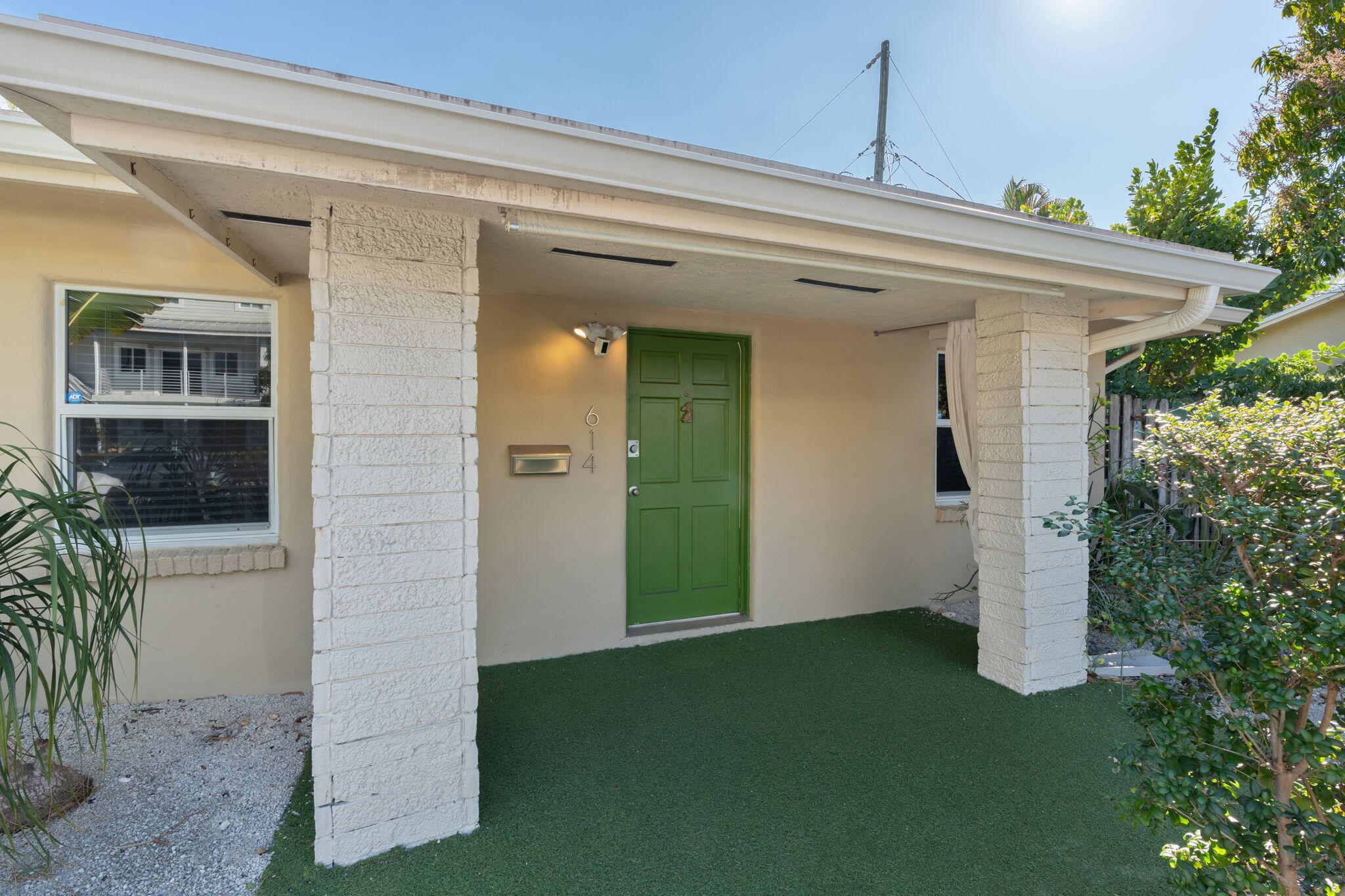 Rare opportunity to enjoy the privacy and feel of a single-family home with the ease of condo living in Wilton Manors. This inviting residence features a private fenced backyard—ideal for outdoor dining, relaxing, or pets. The comfortable interior includes an updated kitchen with white cabinets and stainless appliances, laminate flooring, ceiling fans, and a new water heater. Unit can be sold furnished. Located just steps from the community pool, offering resort-style enjoyment without the upkeep. Two assigned parking spaces are included right outside your front door. Pet-friendly and well-run, financially secure complex. Quietly situated yet blocks from Wilton Drive's dining, shopping, nightlife, and parks. A perfect blend of privacy, outdoor space, and the vibrant Wilton Manors lifestyle