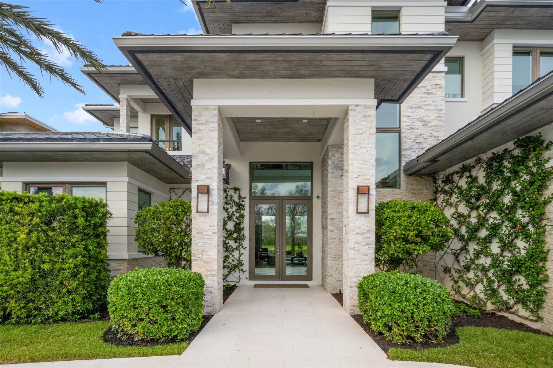 Nestled perfectly on Blue Cypress Lane in the exclusive, highly coveted subdivision of Palm Beach Polo Golf and Country Club, this 4 bed 4.5 bath features some of the best lake and golf course views bar none in the Polo Club. The property sits across a large lake and a wedge shot away from the famous island green Par 3 11th hole on the Cypress Course with lush preserve background views where you can entertain amongst the summer kitchen, spacious patio and sleek in-ground pool and spa. Architectural design style with all high end finishes that include ceramic tile and hardwood floors throughout. All impact windows and doors, Calcutta marble countertops, custom kitchen cabinetry and bedroom cabinets with his and her walk ins,  double vanity and freestanding soaker tub for Master bath, modernized lineal ceilings, and air vents. The second story guest suite has the feel and space of a second master bedroom and bath. 

The property was upgraded with all of the following within the last 2 years: Whole house interior painting, New 24" U Line outdoor stainless steel refrigerator, New Lynx Sedona 3 Burner LP Gas Grill 
New Quartz Caeserstone countertops in laundry room and undermount sink , New Variable speed pool pump 2021 
Installlation of brand new Kitchler and sterling LED integrated landscape lighting system, Aqualink automation system for pool. 
Installation of new Phantom retractable XL wall screen for patio. Installation of Reme Halo UV air purification system for all 3 units. Converted existing irrigation system with brand new centrifugal irrigation pump. Replaced 2 AC systems with New Trane units. 
Upgraded the entire A/V and home automation system to Crestron for smart home technology. Added all new Lutron lighting and switches. 

More features include: 
Motorized Hunter Douglas blinds in master bath. Hunter Douglas blinds in select rooms, Steam feature for shower and 2 washers 2 dryers (Electrolux upstairs)

Palm Beach Polo Golf & Country Club is located in Wellington, Florida, and a short drive from Wellington International / Home of The Winter Equestrian Festival.