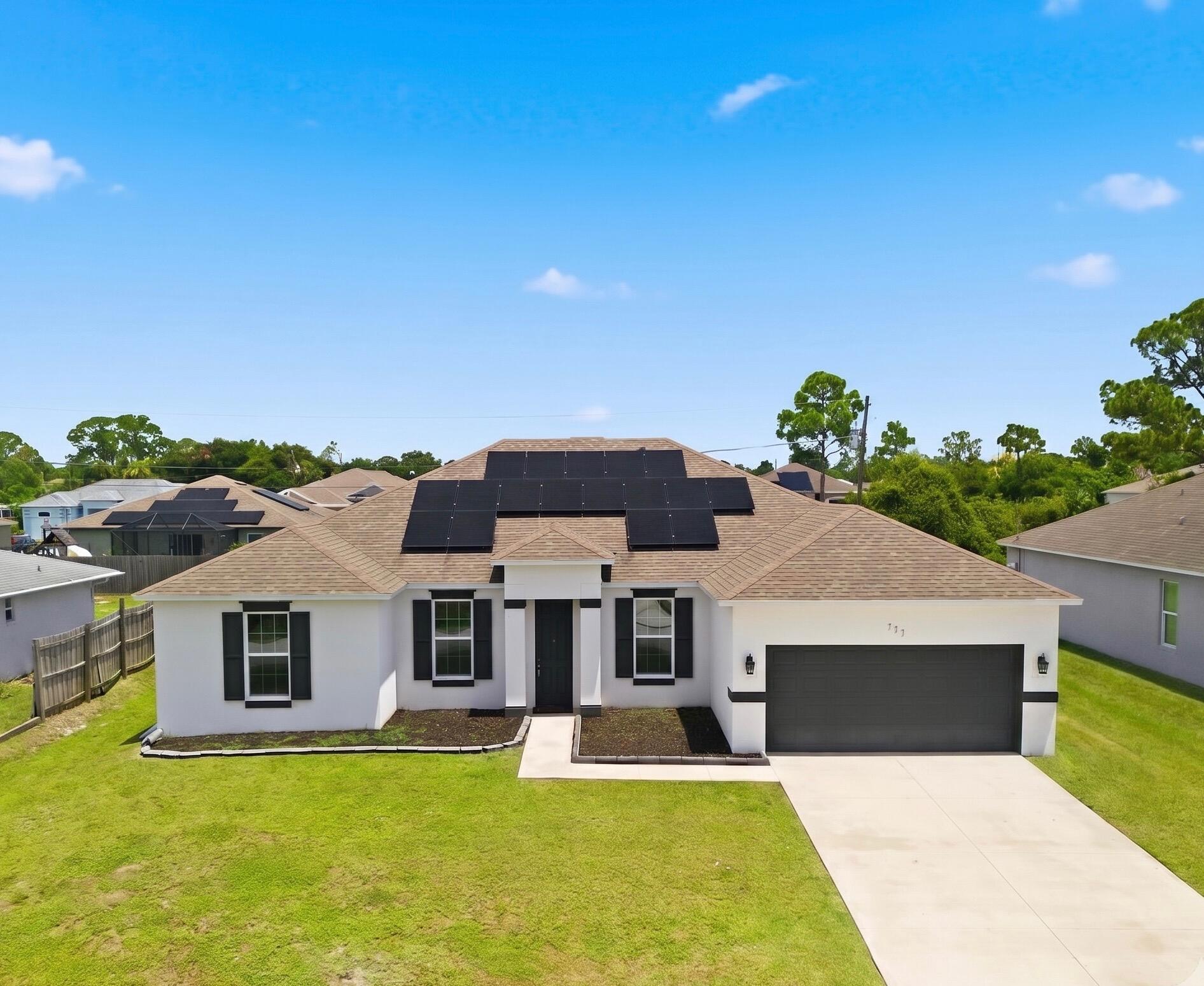 Welcome to this beautifully maintained, modern 4-bedroom, 3-bathroom home offering over 2,300 square feet of light-filled living space in a desirable SE Palm Bay neighborhood with no HOA. Step inside to a spacious open-concept layout designed for effortless entertaining, featuring a chef-ready kitchen with a central island and pantry. The thoughtful split-bedroom floor plan ensures ultimate privacy for the primary suite, which boasts an oversized walk-in closet and a walk-in shower. Equipped for peace of mind and maximum efficiency with storm panels and a solar panel system. Best of all, the seller will pay off the entire solar panel system in full at closing, handing the new owner equity and lower electric bills from day one! Relax on your screened patio overlooking a cleared backyard.
