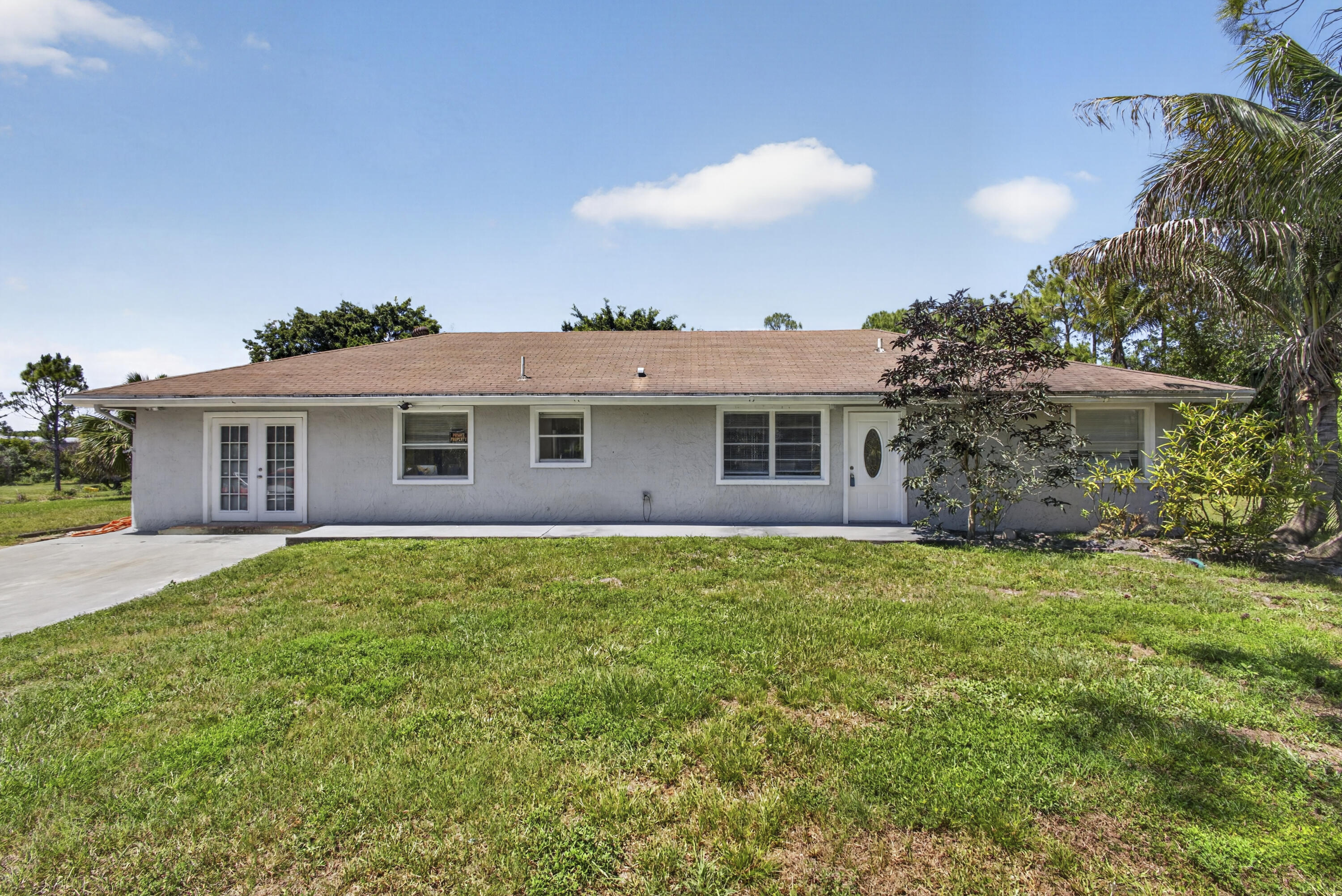 Welcome to this beautifully updated property located at 16663 89th Place N in Loxahatchee. This home features a functional and versatile layout, including a converted one-car garage currently being utilized as a spacious fourth bedroom, offering additional living space for a variety of needs. Recently updated, the home has been freshly painted and features new tile flooring throughout. The patio has also been fully remodeled, creating the perfect space for outdoor enjoyment and entertaining. A wonderful opportunity to enjoy comfortable living in a desirable location.