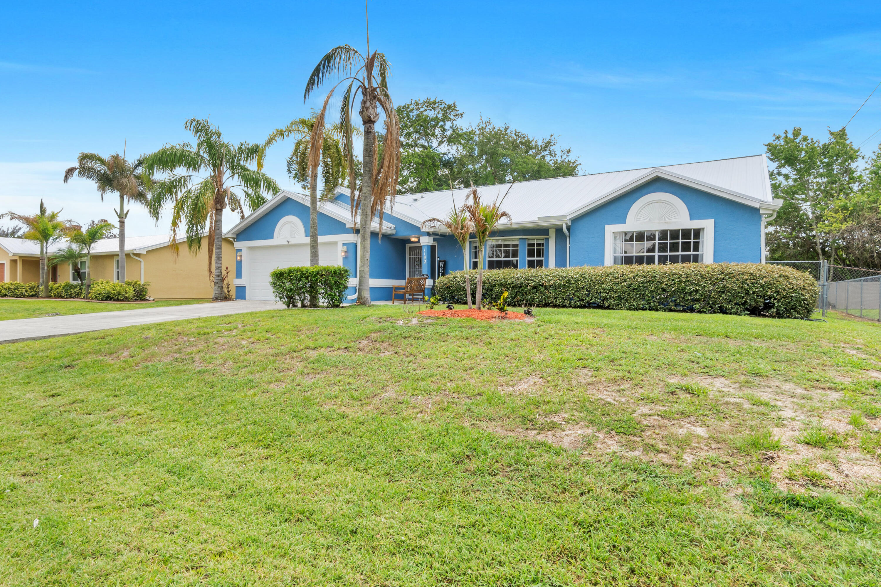 New Metal Roof, New Paint. Prepare to be impressed by this stunning Waterfront Pool Home! This 1,920 sq. ft. home blends modern upgrades with timeless charm. This home is move in ready with minimal maintenance needed. Inside, enjoy tile flooring, vaulted ceilings, and a split-bedroom layout. The chef's kitchen boasts stainless steel appliances, updated cabinetry, and granite countertops. The oversized master suite includes a remodeled bath with a spa tub, spa shower, dual sinks, and spacious walk-in closets. Step outside to your private oasis with a screened patio, sparkling heated pool, cabana bath, and serene canal views. Situated on a 10,000 sq. ft. lot near I-95, beaches, and shopping. Don't miss this gem—schedule your showing today!