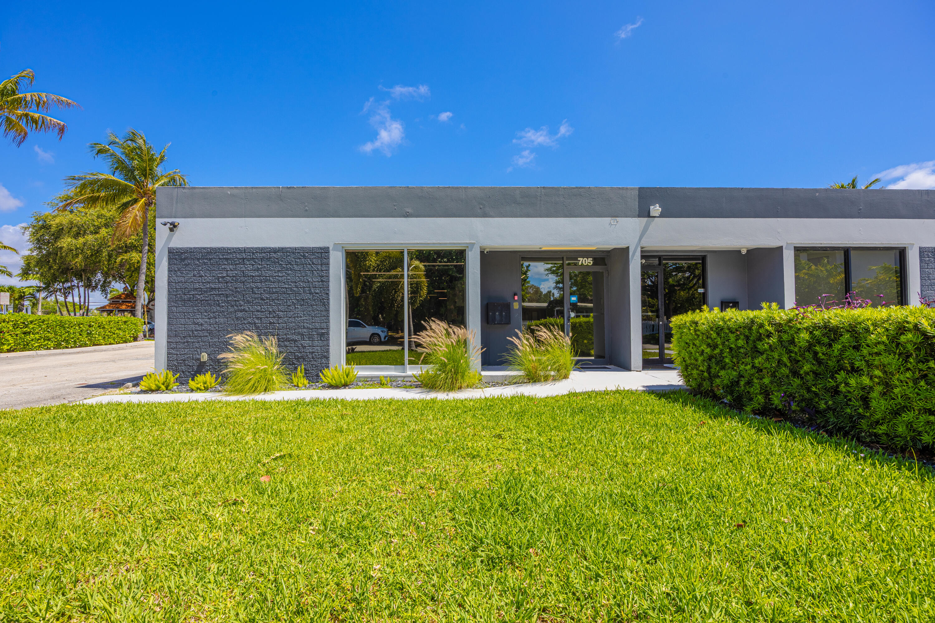 This commercial flex space is positioned in East Delray Beach, one of South Florida's most desirable submarkets, located less than a block from Federal Hwy. (US-1), approx. a mile from Downtown Delray Beach and the Atlantic Ocean. This property presents a rare opportunity to acquire a renovated, standalone suite which offers accessibility and versatility for various commercial uses including showroom, office-professional-medical-business, retail, service and facility, and speciality business operations. The facility has undergone extensive renovations, including updated electrical systems, HVAC, and security, providing a turnkey, unique offering for both owner-users and investors. The property's combination of coastal location, flexible zoning, modern upgrades,  ample parking with grade-level doors, and proximity to Delray Beach's vibrant downtown makes this a prime location. Additionally, it's conveniently situated across from PopStroke mini golf on Federal Highway which offers delicious dining options. Ultimately, the area continues to experience strong economic growth driven by demographics, significant residential investment-rebuilding, and increasing demand for commercial redevelopment near the downtown core, creating a highly attractive environment for businesses seeking a Palm Beach County location.