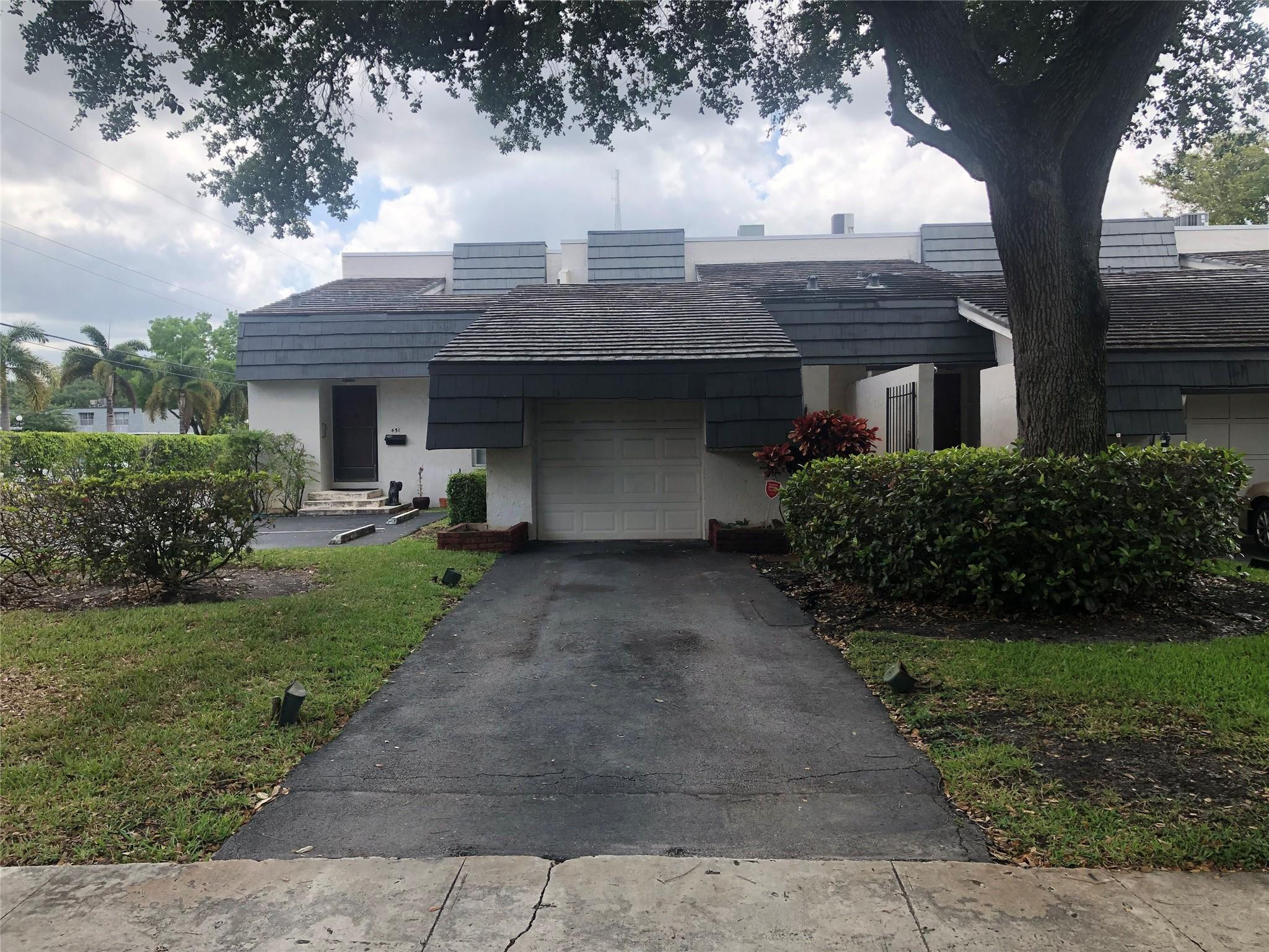 Don't miss this incredible opportunity to own a home in a highly desirable, dog-friendly community! The seller is motivated and willing to work with buyers to help make this property yours.  This cozy home features 2 bedrooms, 2.5 bathrooms, and a garage, along with hurricane-impact sliding doors for added peace of mind. Ideally located near the Turnpike, I-95, and I-595, you'll enjoy quick access to shopping plazas, restaurants, parks, and malls—plus you're just 15-20 minutes from the beach!  This property is perfect for investors or buyers looking to add their personal touch—a true handyman special with great potential.  Don't miss out—schedule your showing today!