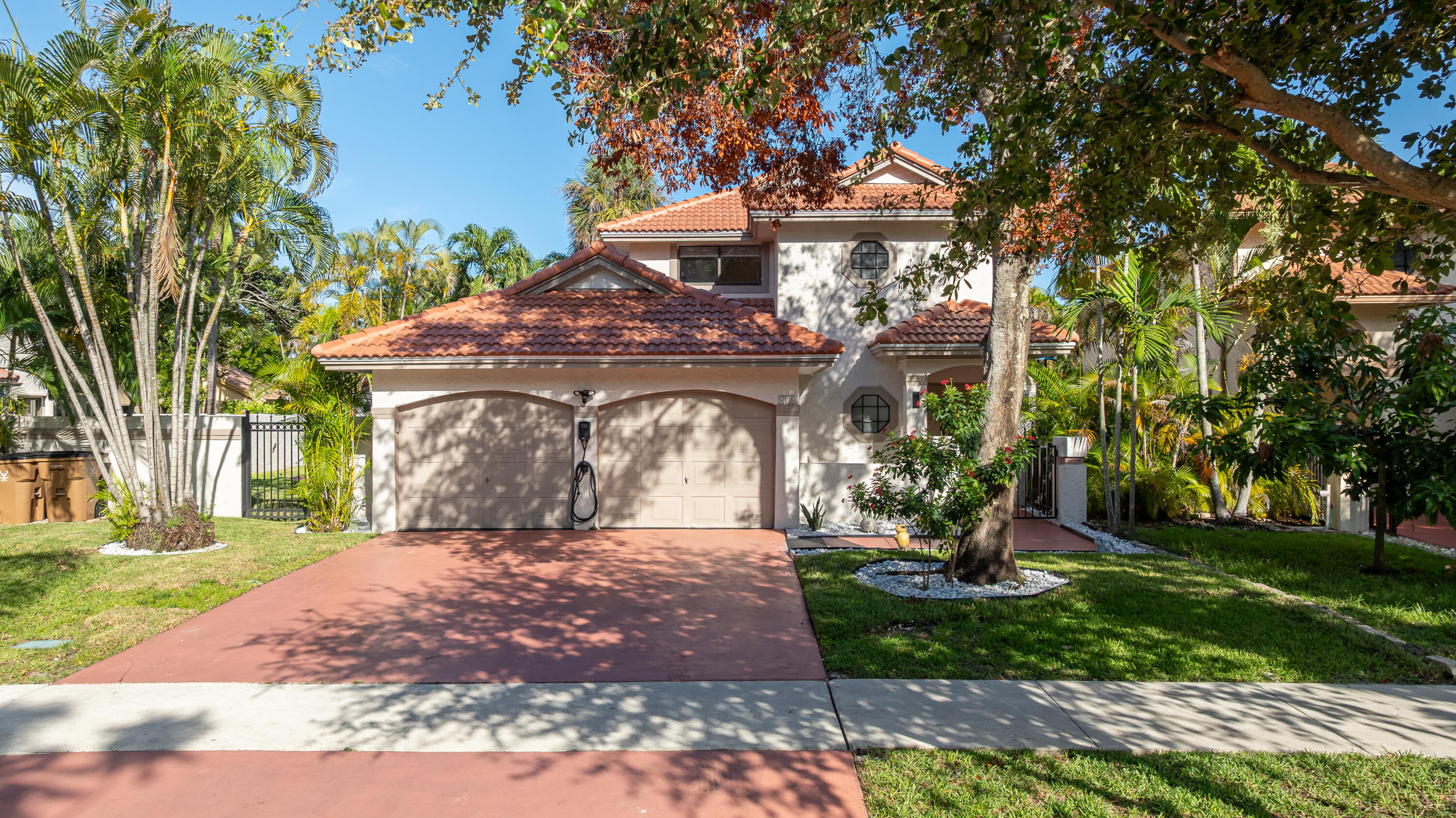 Welcome home to your fully renovated 3-bedroom, 2.5-bath paradise, offered turnkey with designer finishes throughout. Every detail of this exceptional home has been thoughtfully upgraded, including a brand-new roof (2025), new air conditioning ducts, all-new appliances, new water heater, remodeled bathrooms, new washer and dryer, and a finished garage. Step outside to your own private tropical retreat featuring a new heated saltwater pool, a spacious tiki hut complete with TV, dedicated barbecue area, and multiple lounging spaces designed for entertaining and relaxation. This home seamlessly blends luxury, comfort, and resort-style living  all ready for you to move in and enjoy. Low HOA fee's close to shopping, restaurants, beach, and Highway make it the perfect location to raise a family. Text Listing agent with any questions.