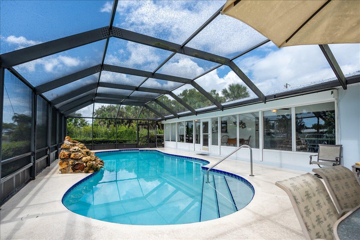 Beautiful Ocean Access Canal House with a heated pool! Recently remodeled. Spot the Manatees and Dolphins on a regular basis and great fishing right off the dock!. Minutes from downtown restaurants & shopping at Miracle Mile and beaches. Neighborhood is quiet and laid back, perfect for walking & jogging.  This property is the best of all worlds! Owner pays for pool care.  Shorter lease terms negotiable. Additional Dock and Boat Lift security deposit negotiable. Roof 2024. THIS IS AN ACTIVE SHORT TERM RENTAL. Showings can only be accommodated when the home is UNOCCUIPED. There is one step down into the sun room. Call listing agent to schedule and see right away!