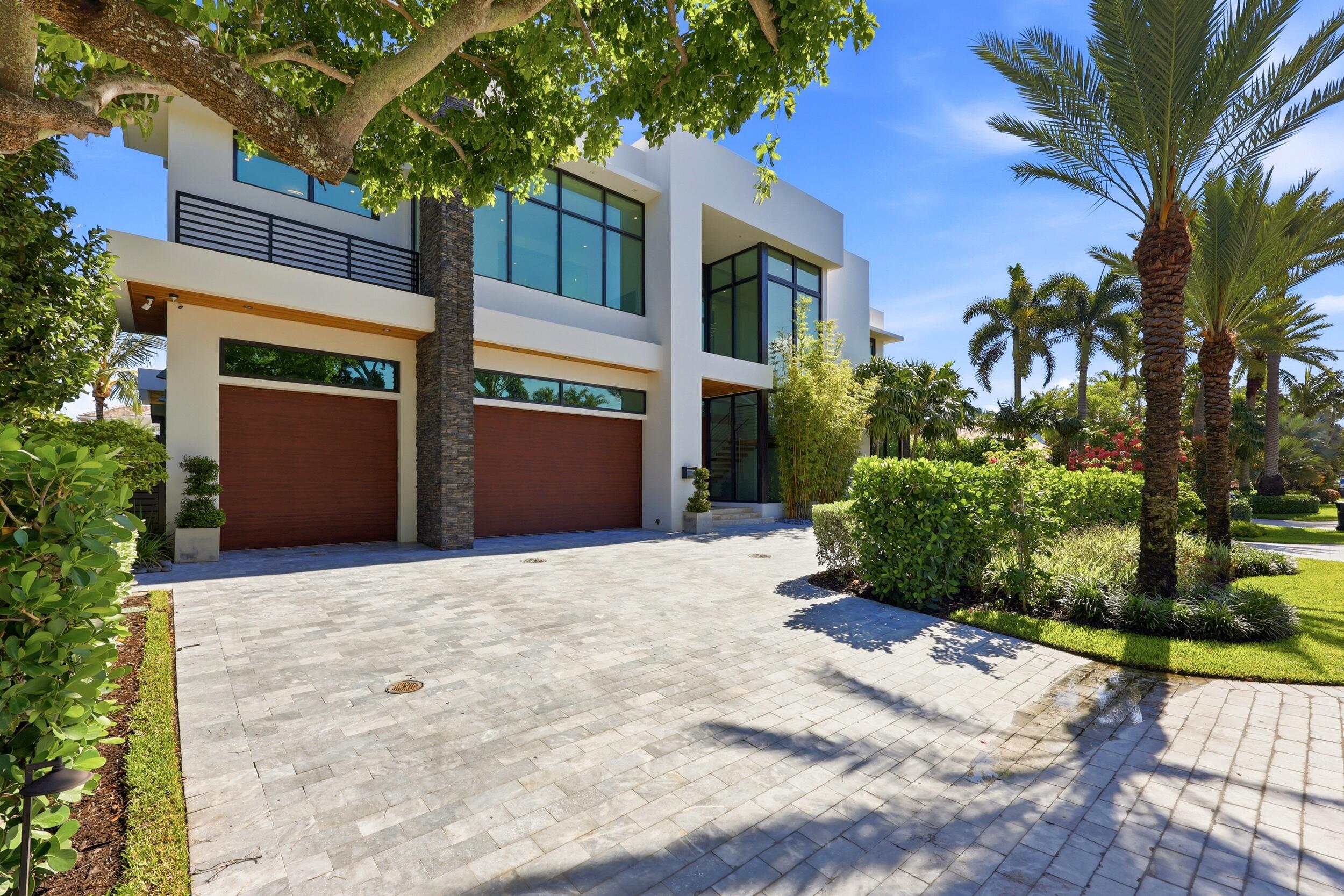 Completed 2022 | 7,500 total SF contemporary waterfront estate on 100' of deep water with direct Intracoastal access and no fixed bridges. 6 beds, 6 full and 2 half baths, 3 car garage. Italkraft chef and butler kitchens, Sub-Zero, Wolf & Dacor appliances, Level 5 quartz & 1,000 bottle wine room. Private gym, Lutron smart home system, 18 speaker audio, 4 zone A/C, Kohler 38K generator, 1,000 gal propane tank, Porcelain baths & floors downs, European oak floors upstairs, floating walnut staircase, SS elevator and 1,500SF owner's suite with breakfast bar. Oversized pivot entry door, 11 & 12' Collapsible sliding doors open the living space seamlessly to the outdoors. Heated saltwater pool/spa, custom outdoor kitchen, concrete dock with power pedestal and dolphin piles, Fully furnished. Please use showing time to schedule showings. 24 hr notice required.