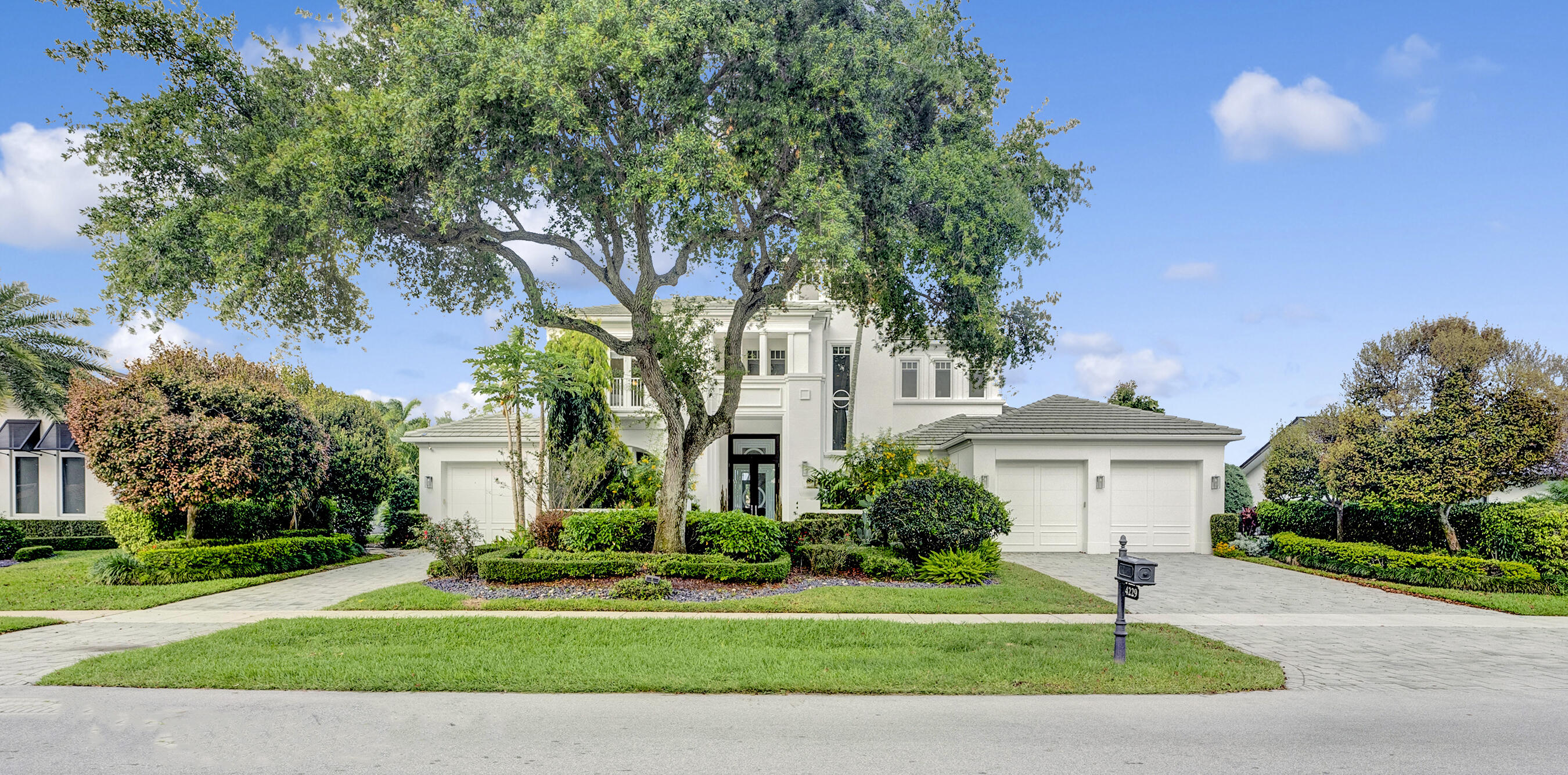 Welcome to your dream oasis at Delaire Country Club! Nestled on a picturesque lake view lot, this stunning modern custom home offers unrivaled tranquility and luxury living.
As you step inside, be greeted by panoramic vistas of the lush golf course and lake, ensuring privacy and serenity with no golf cart paths or players directly behind you. Say goodbye to traffic noises as you immerse yourself in the peaceful ambiance of this highly desirable and award-winning community. Designed for the discerning homeowner, this residence boasts coffered ceilings and impact glass throughout, embodying both elegance and durability. Complete with a comprehensive security system and hurricane impact glass, peace of mind is paramount. The first floor invites you into a spacious living and dining area with soaring ceilings, seamlessly flowing into a state-of-the-art gourmet kitchen and family room with a convenient wet bar. For the avid professional or remote worker, a beautifully appointed study/office awaits, adorned with gleaming hardwood floors and built-in bookcases, offering the perfect blend of functionality and sophistication. Retreat to the lavish primary bedroom suite, featuring separate dual bathrooms and custom walk-in closets, ensuring every indulgence is catered to. An additional en-suite guest bedroom on the first floor provides comfort and convenience for visitors. Ascend the marble staircase to discover an open loft area, easily convertible into another bedroom, offering breathtaking views of the pristine golf course and shimmering lake. With a total of three en-suite bedrooms, ample storage, and a two-car garage plus a dedicated space for golf carts, this home effortlessly combines practicality with luxury. A large laundry room adds to the convenience of daily living. Step outside to your own private paradise, where a resort-style lap pool and spa beckon for relaxation, accompanied by a covered lanai equipped with automatic screens and a summer kitchen, perfect for al fresco dining and entertaining. Don't miss this opportunity to experience the epitome of upscale living in Delaire Country Club. Schedule your private tour today and make this masterpiece yours! Delaire Country Club is not just a residence, but a private boutique country club, where 324 custom homes surround a 27-hole championship golf course that requires no tee time. The clubhouse itself is a work of art, featuring a state-of-the-art 16,000 sq ft fitness center, outstanding culinary cuisine, a resort-style pool area, and 8 Har-Tru tennis courts. Enjoy the generous extended family policy that Delaire offers, ensuring that you and your loved ones can fully embrace the country club lifestyle.