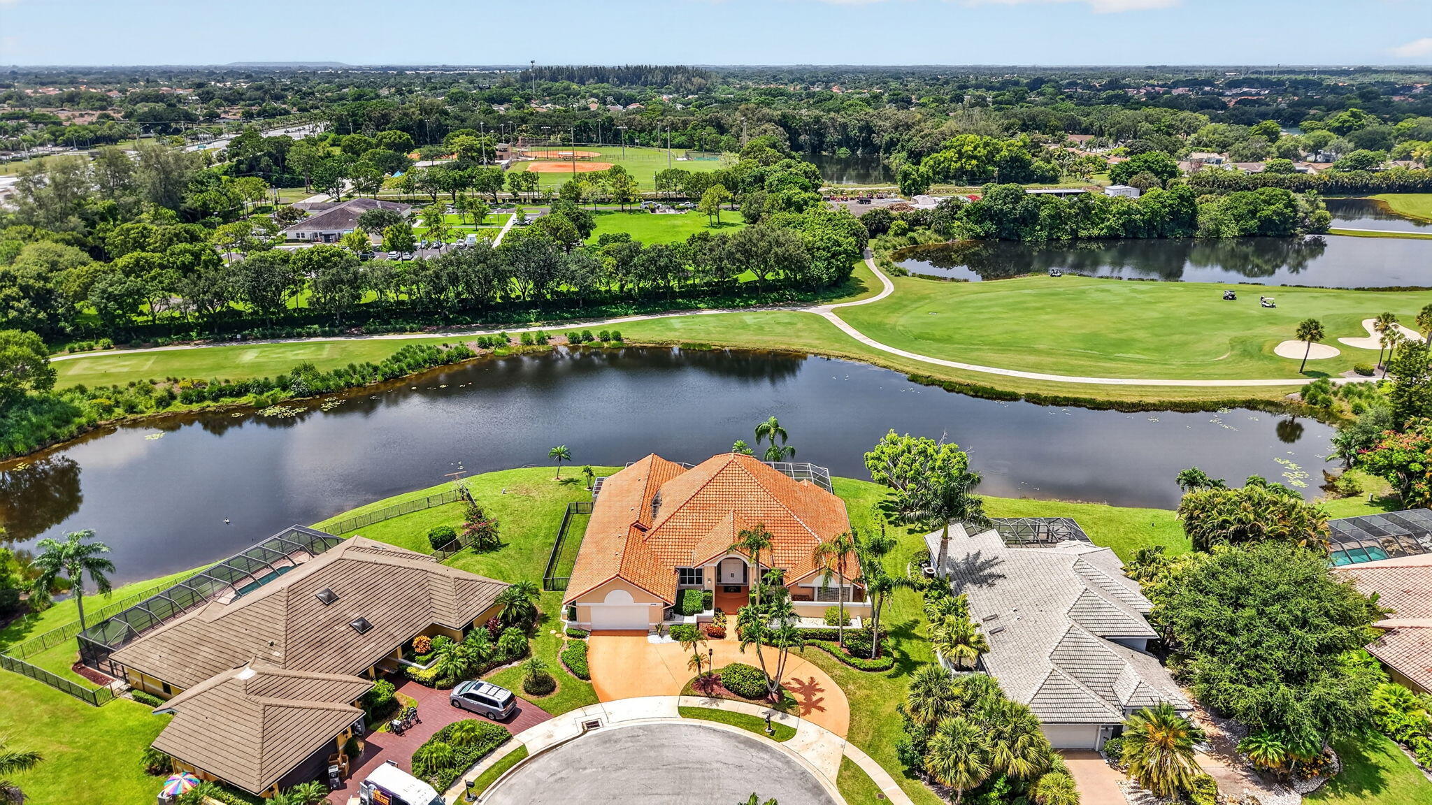 Welcome to one of the most sought after homesites in Stonebridge! This oversized ranch home features soaring ceilings, a grand entrance, 4BR/3.5BA/office, family room, living room and dining room combination with a wet bar. Located in a cul de sac there is complete peace when you drive up to your circular driveway. There is a large sized pool and spa inside the lanai overlooking the lake and golf course as well as a side fenced yard. The layout of the home offers a triple split plan perfect for entertaining and guests. This home offers many upgrades including the primary bathroom and the other 3 bathrooms. The main floor is marble, with hardwood floors in 3 BR and carpet in the office and 1 BR. Some impact glass and doors were also added. See more... This is a rare opportunity to own a true estate style home in one of Boca Raton's most sought after country clubs! Stonebridge Country Club is a mandatory membership club and has 398 single gamily homes. The state of the art amenities offered include a Kipp Schulties 18 hole golf course, 6 har-tru tennis courts (4 lit for evening play), 4 pickleball courts (2 hard and 2 har-tru with 2 also lit). The clubhouse features both fine dining and casual dining as well as spa services, a state of the art gym and resort pool. There are racquet and golf pros there to help improve your game and get you ready for league play.  Stonebridge is convenient to shopping, fine dining, major airports, hospitals and museums. Come see what you are missing! Buyer and/or Buyers Broker to verify all information contained herein.