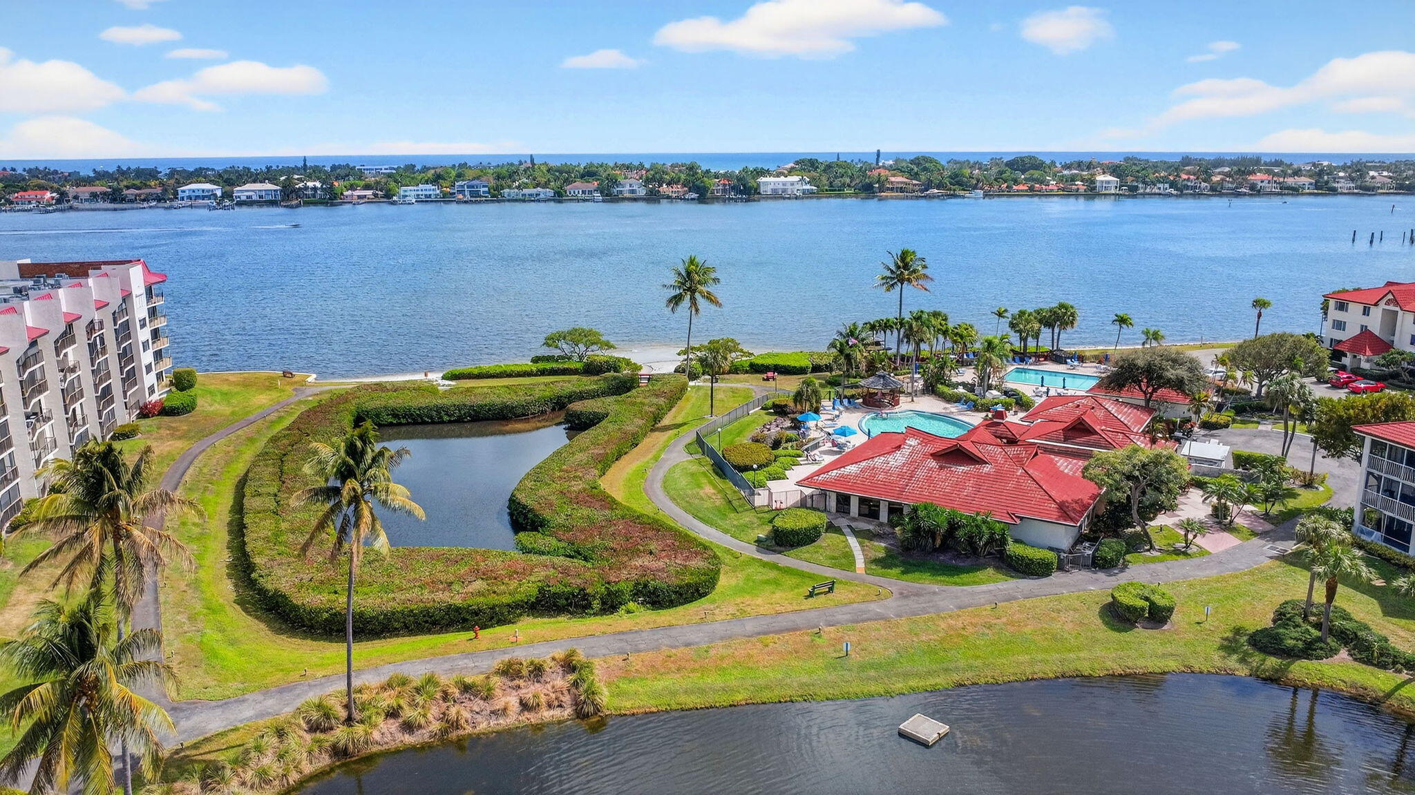 Searching for a 2-bed condo in Hypoluxo under $300,000 with true Intracoastal views and first-floor access? 7030 Half Moon Circle 117 delivers 2 bedrooms, 2 baths, 1,041 sq ft, accordion shutters, and a 2025 new roof inside gated Half Moon Bay.

This first-floor condo features tile flooring, a modern kitchen with electric range and dishwasher, spacious living and dining areas, and a private patio overlooking the Intracoastal. The primary suite offers a walk-in closet and en-suite bath. HOA is $3,400 per quarter and includes water, cable, sewer, trash, and access to two heated pools, spa, tennis courts, billiards, clubhouse, and scenic waterfront paths. Two assigned parking spaces. All-ages community minutes from beaches, I-95, Delray Beach, and West Palm Beach. No Lease 1st year.
